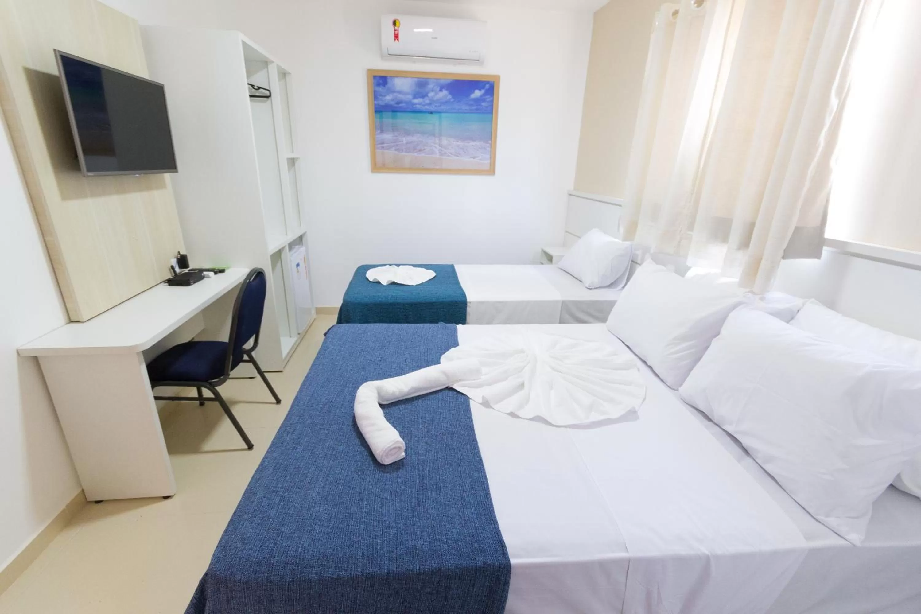 Bed in Pousada Kanoas