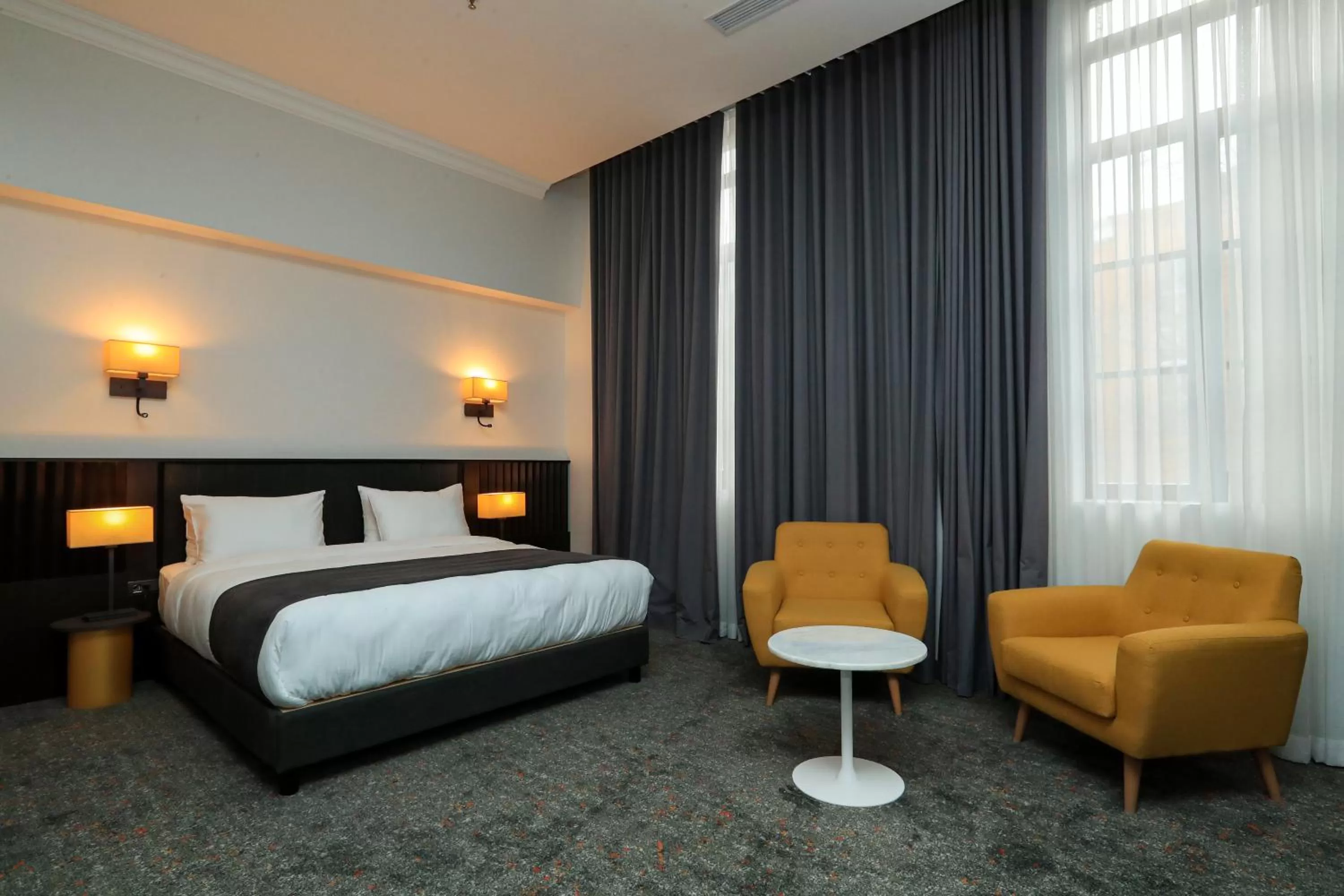 Bed in Pine Astoria Hotel