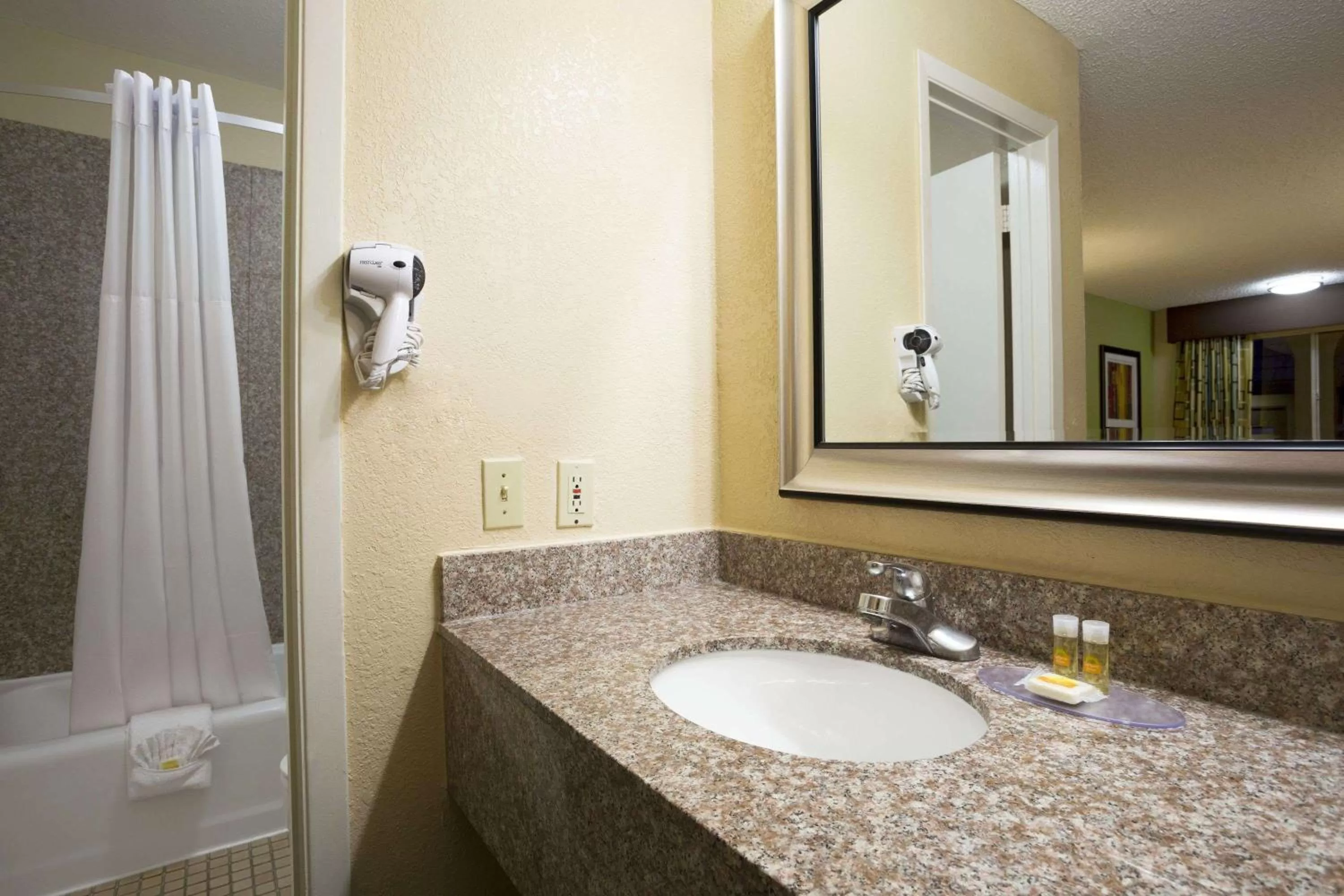 Bathroom in Days Inn by Wyndham Dallas Irving