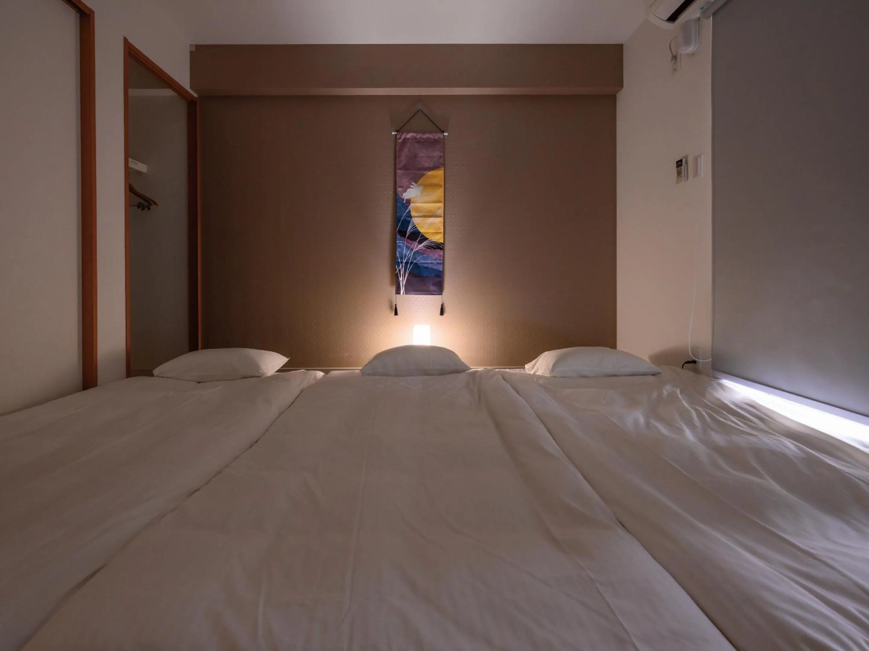 Bed in Condominium L's INN