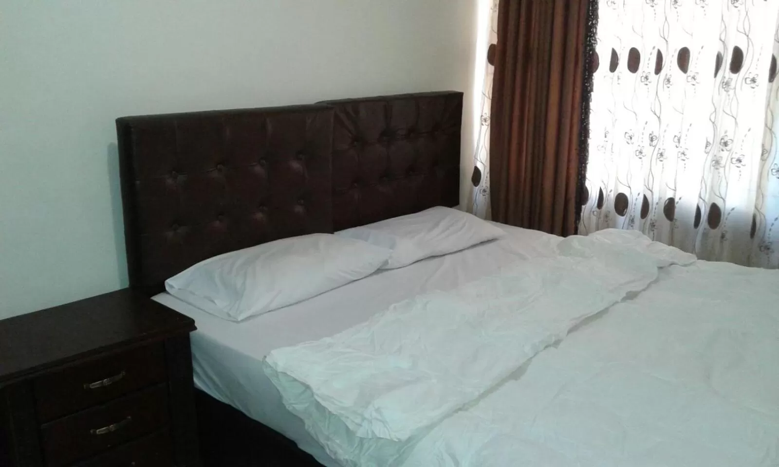 Bed in Al Tawheed Hotel Apartments