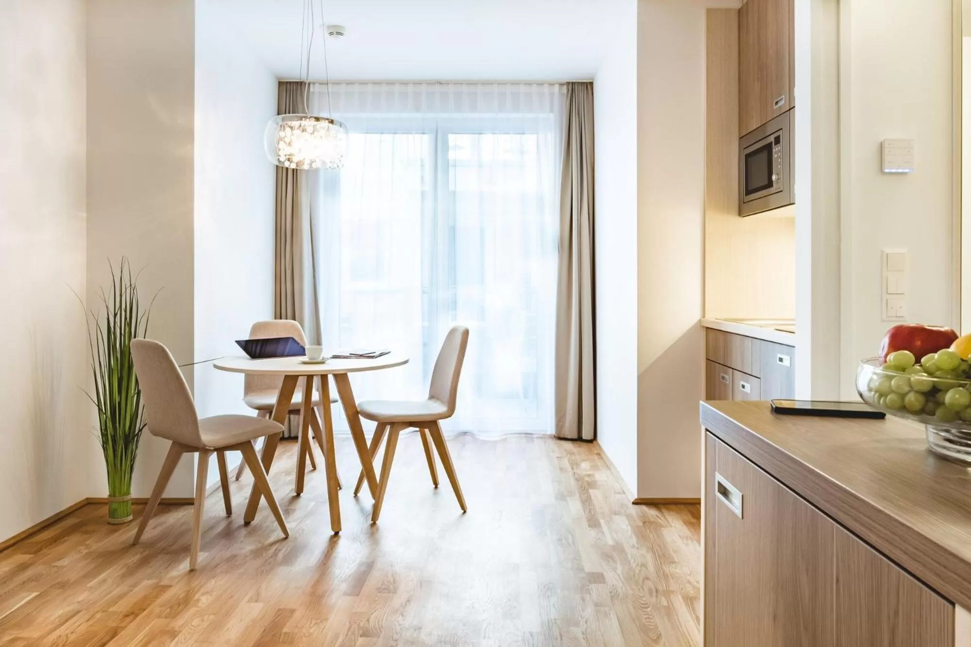 Kitchen or kitchenette in Oliver Apartments | contactless check-in