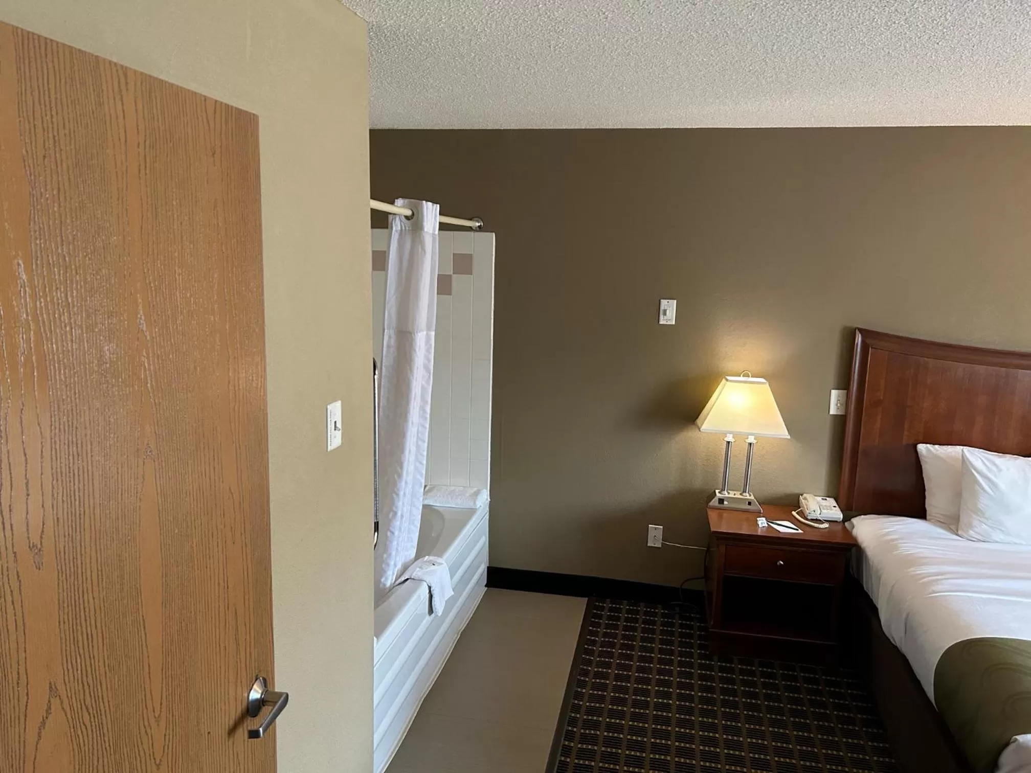 Bed in Quality Inn & Suites