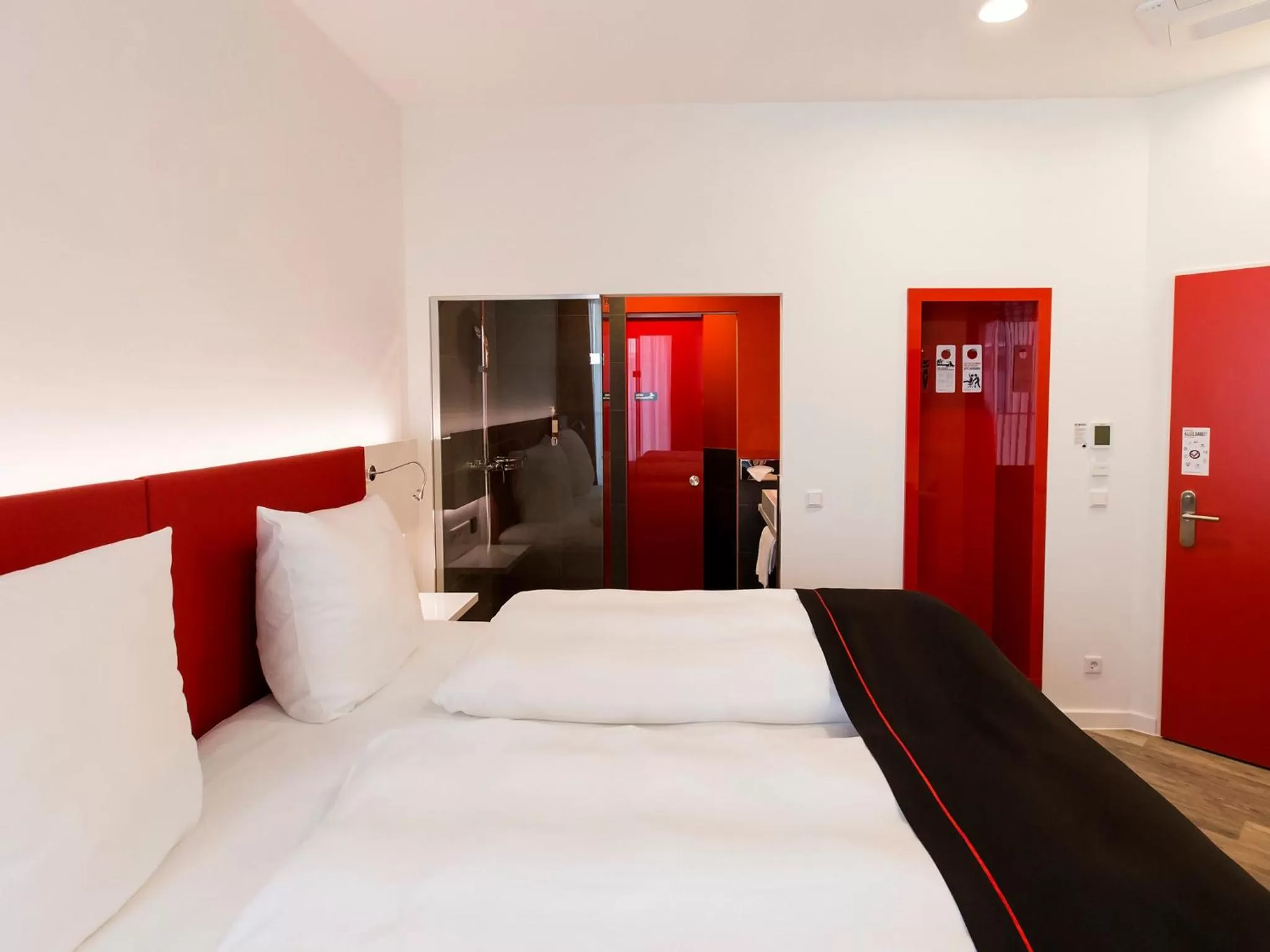 Bed in DORMERO Hotel Roth