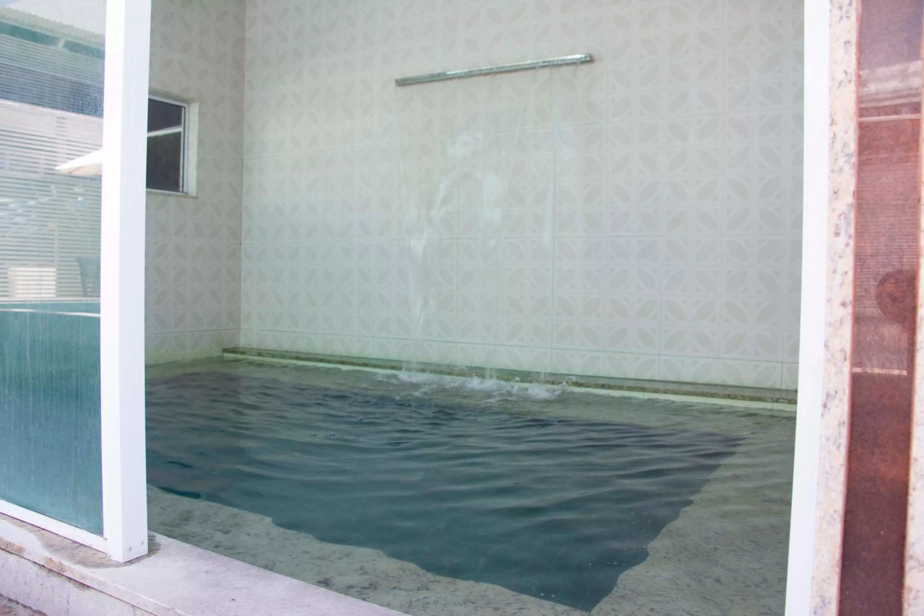 Swimming pool in Pousada SUN Victory