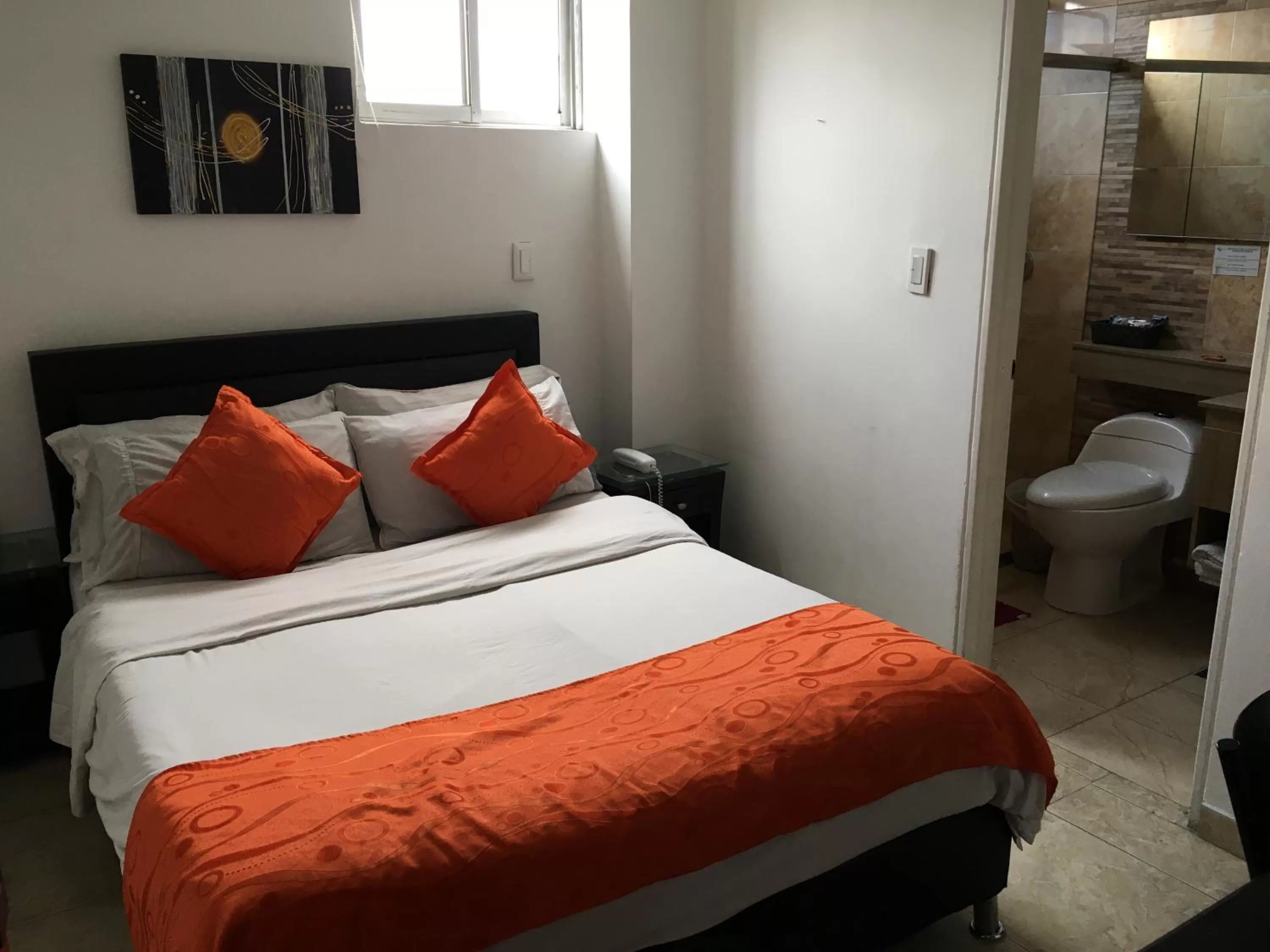 Bedroom, Bed in Hotel Fénix Real Bogotá