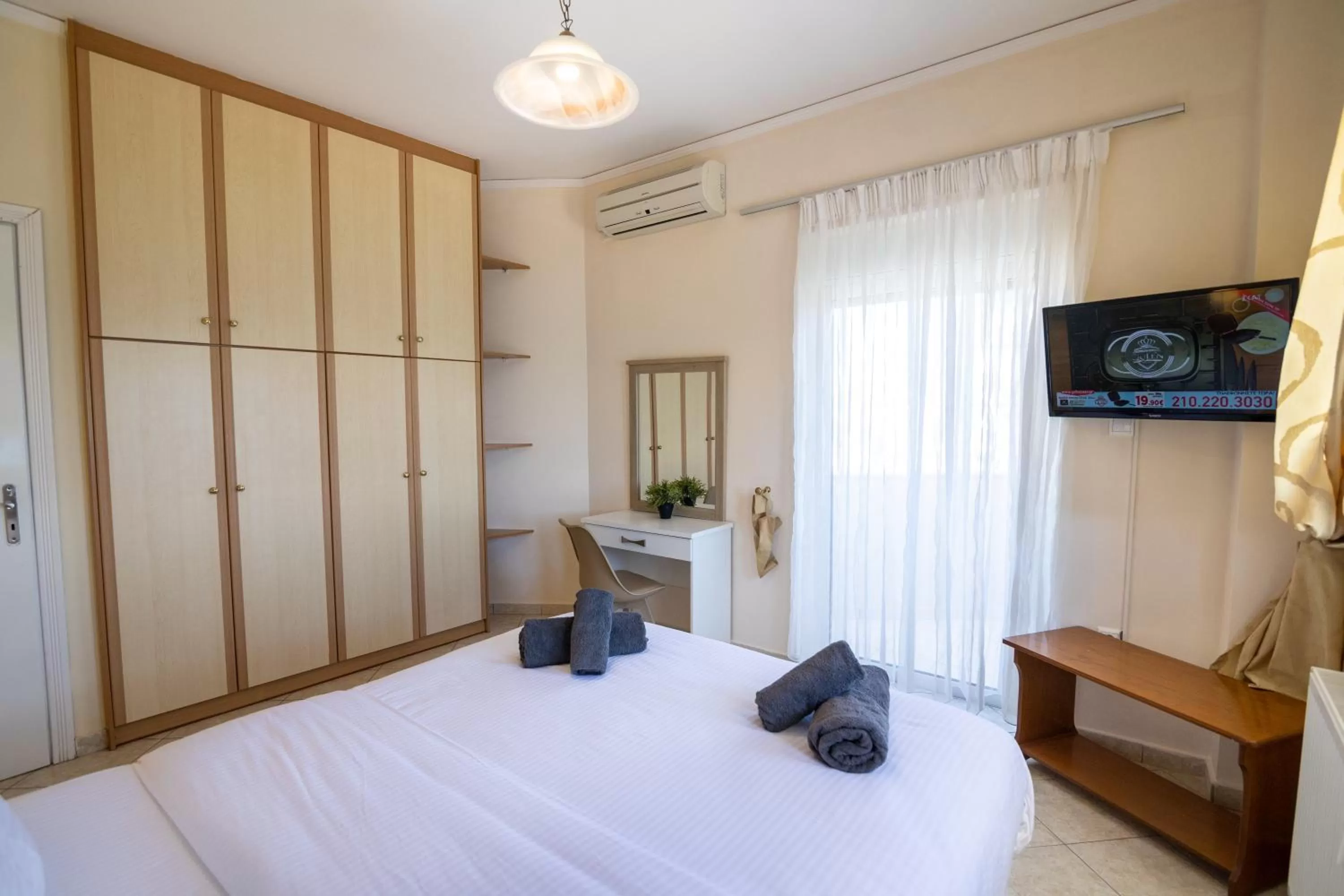 Bed in Votsalakia Hotel & Luxury Apartments