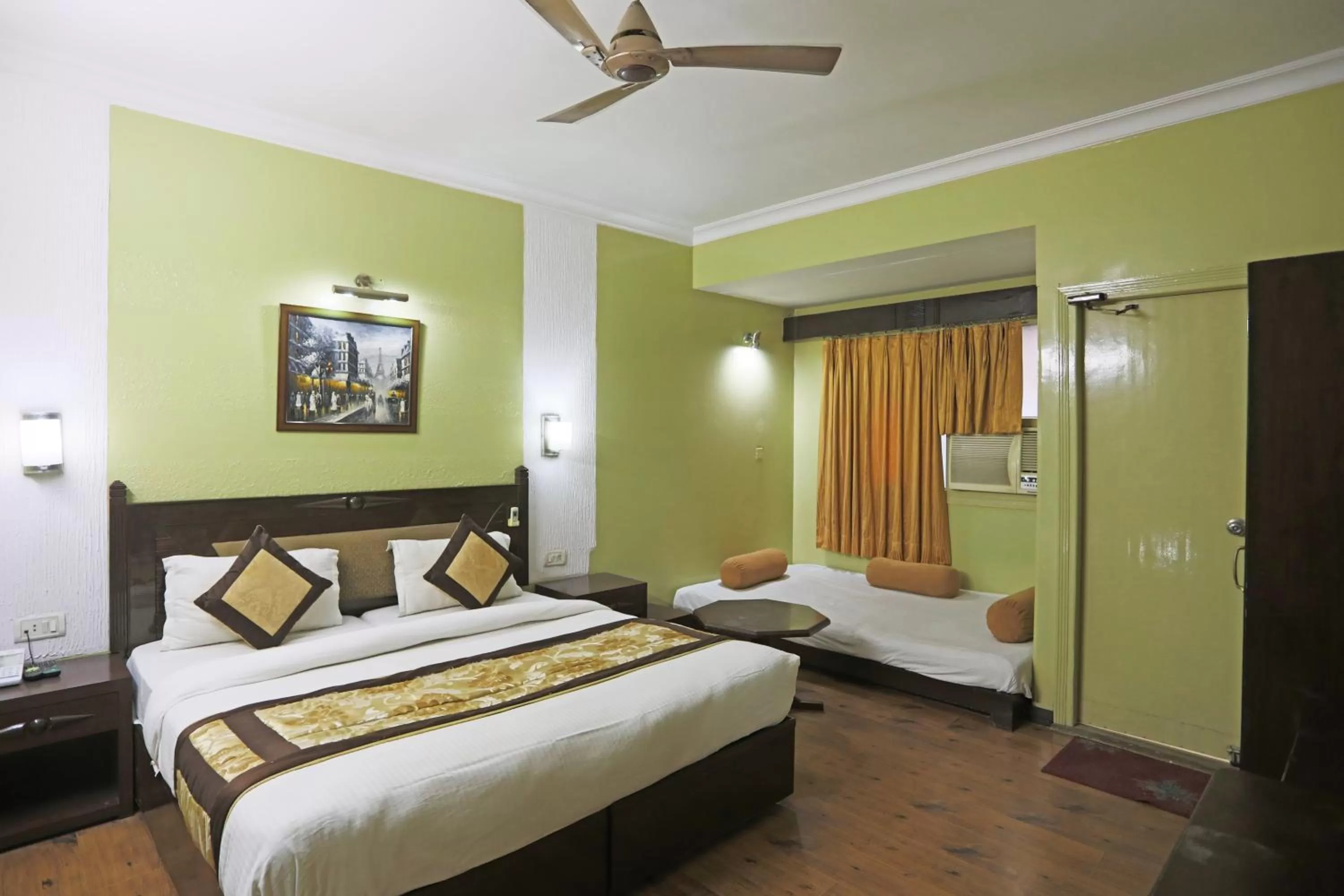 Photo of the whole room in Hotel The Tourist - 1 min from New Delhi Railway Station