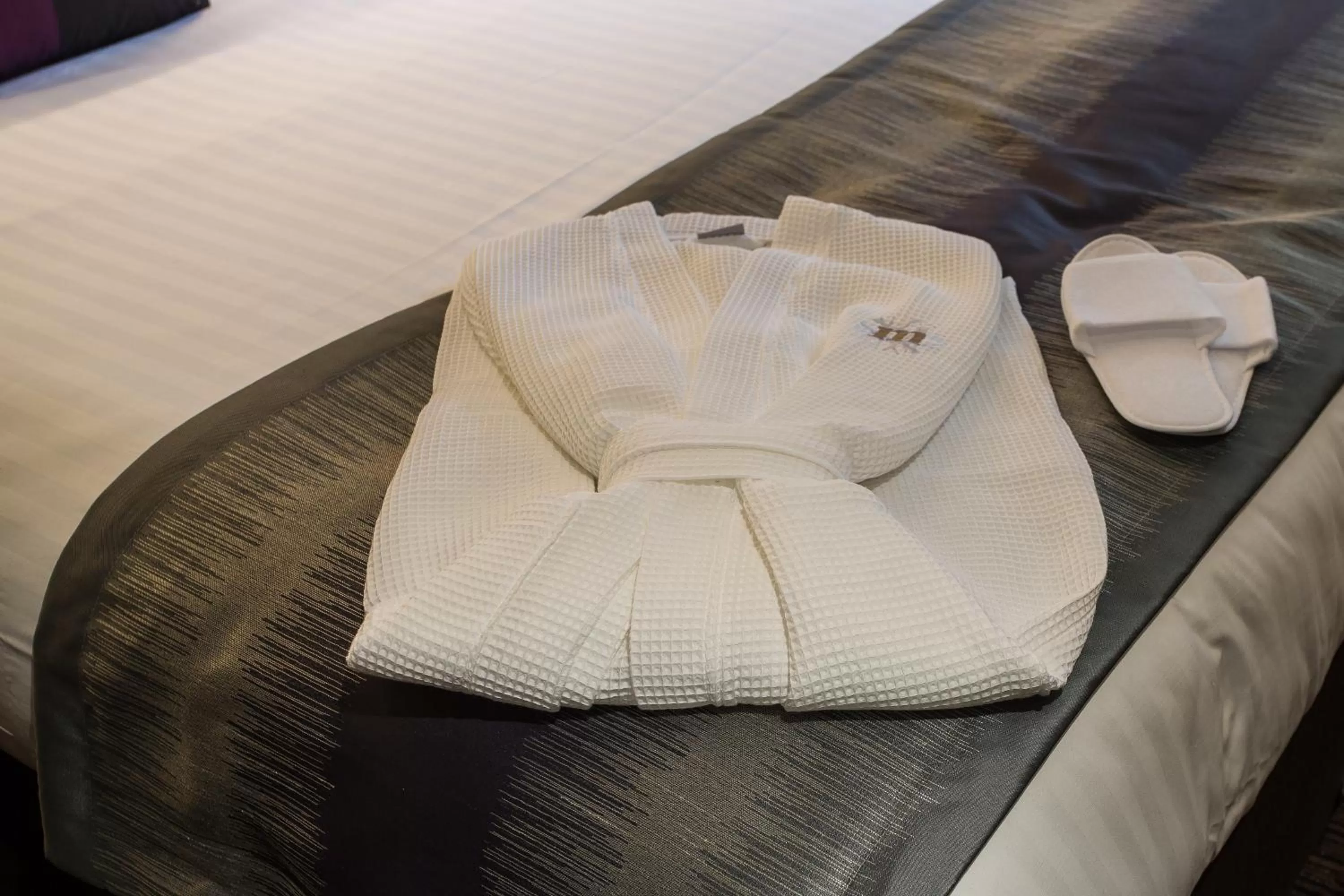 Bedroom in Mondo Hotel