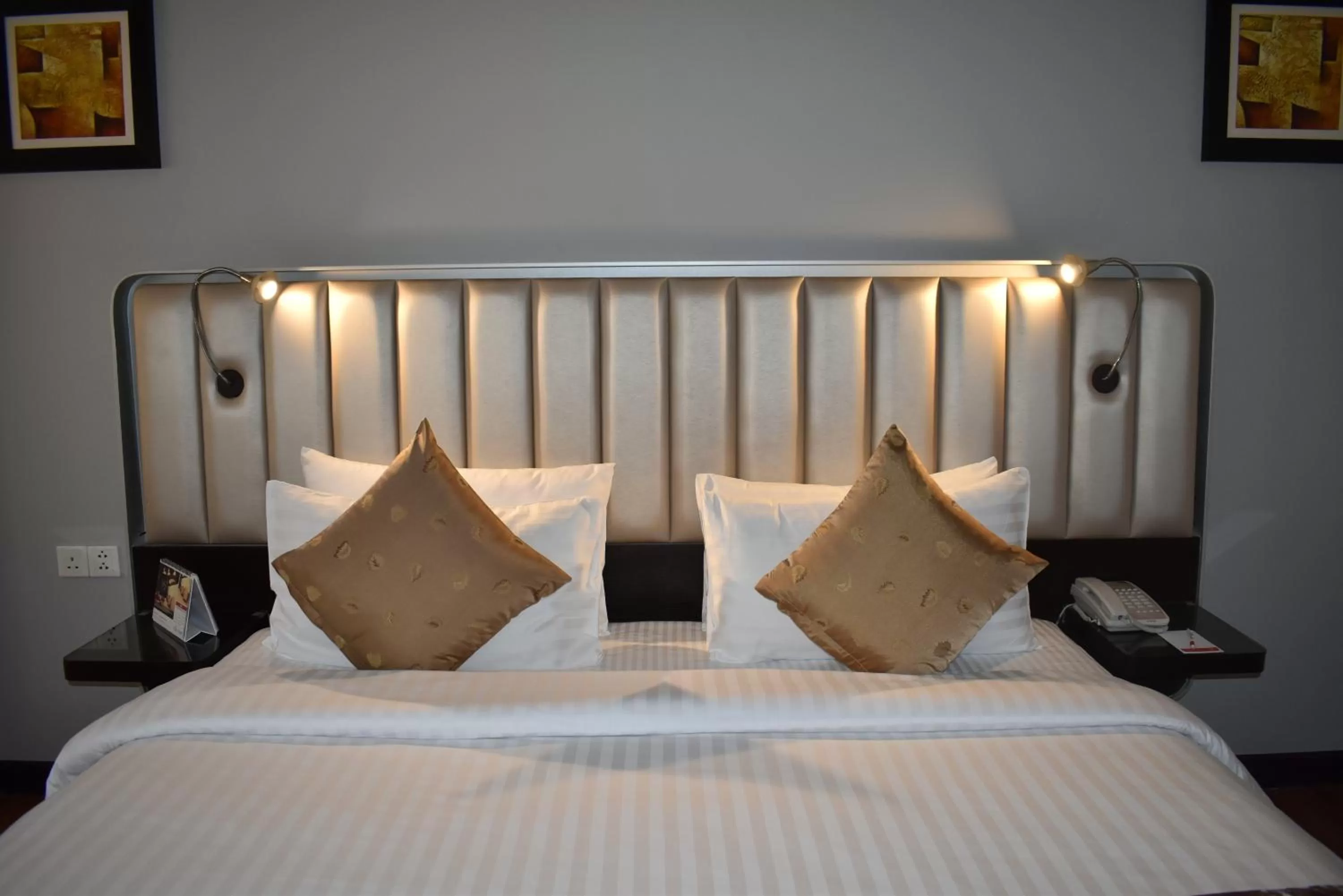 Bed in Ramada Plaza by Wyndham Karachi Airport Hotel