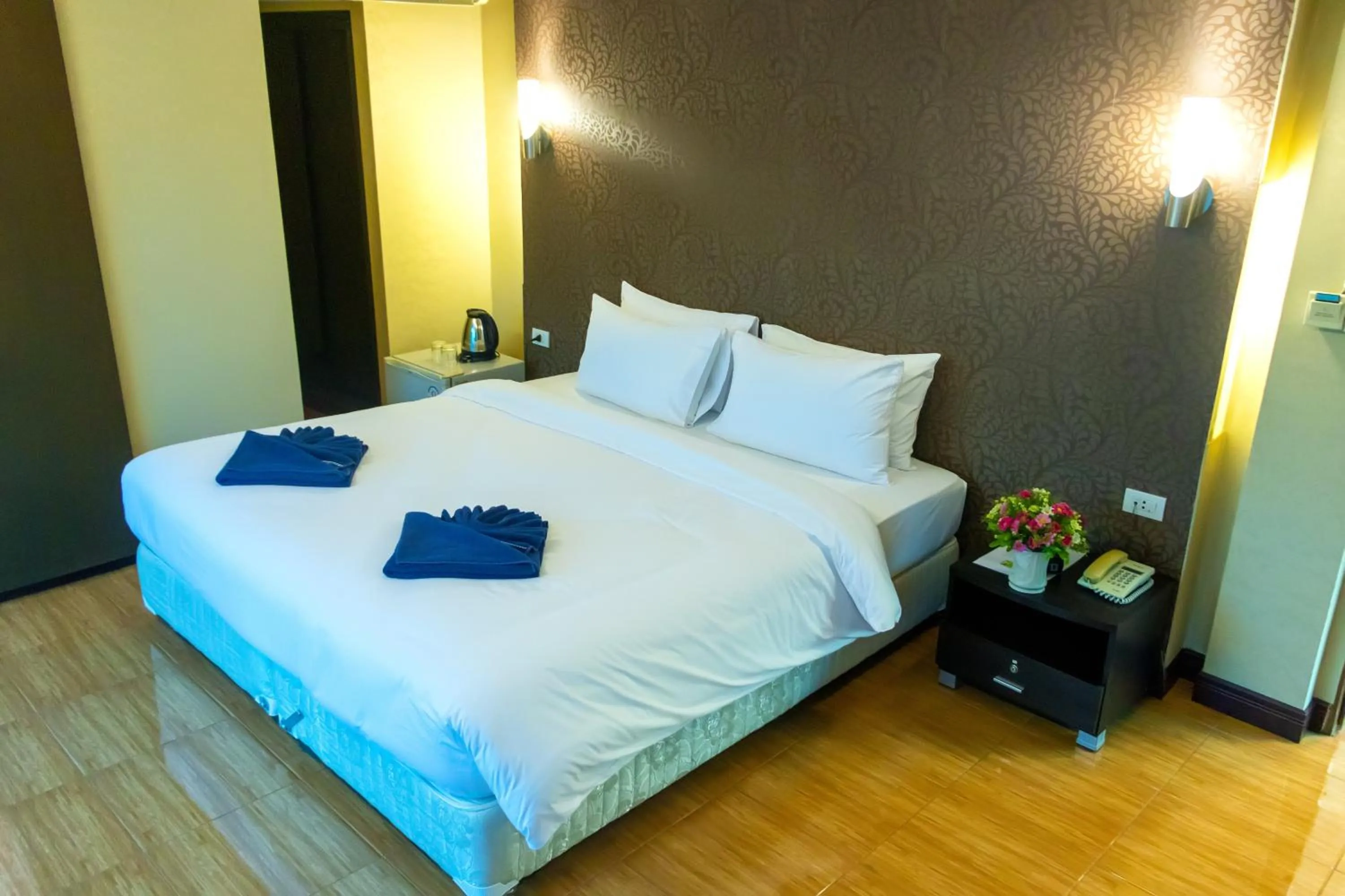 Bed in Visiting Card Hotel & Resort