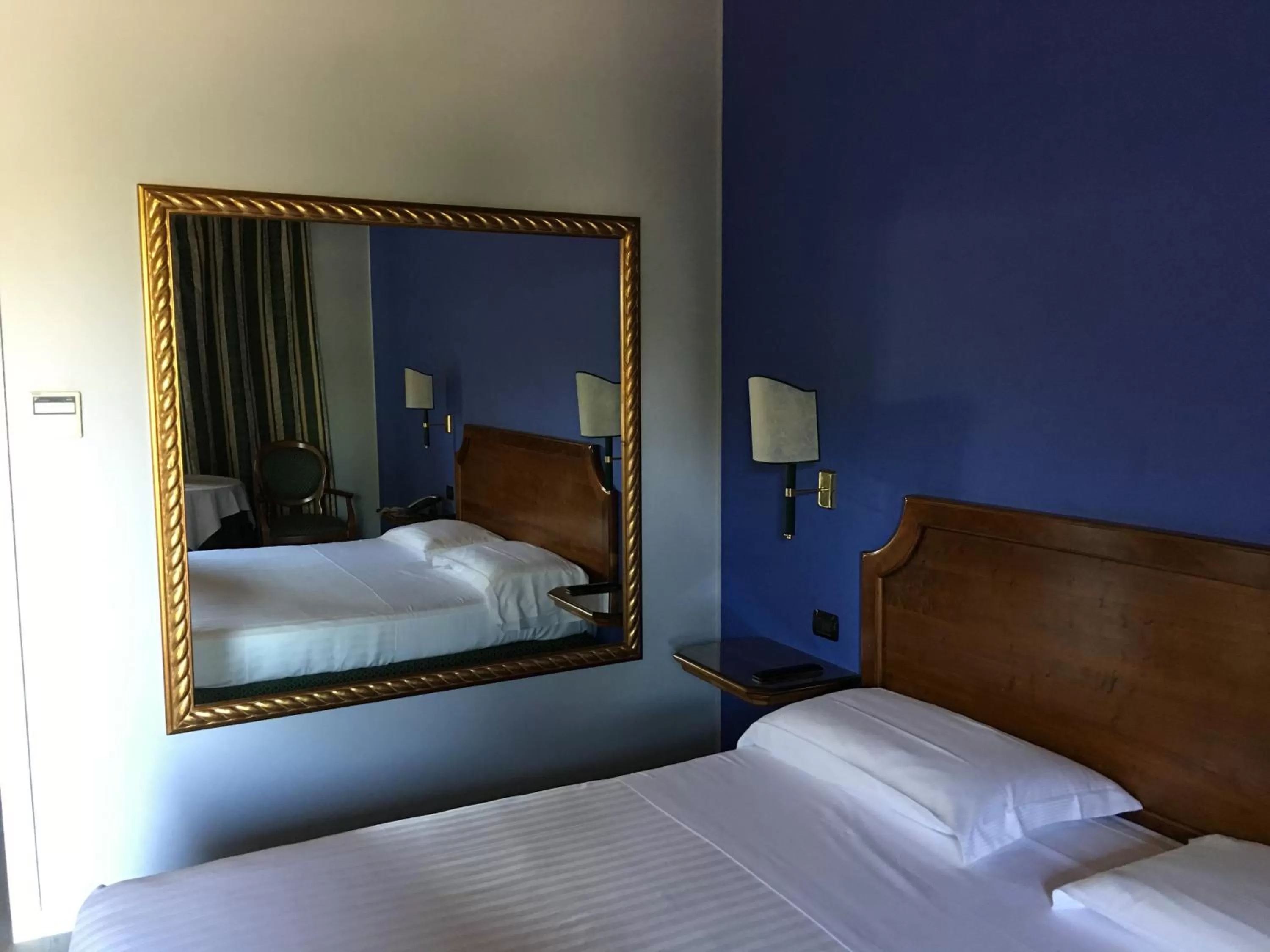 Bed in Hotel Don Carlo