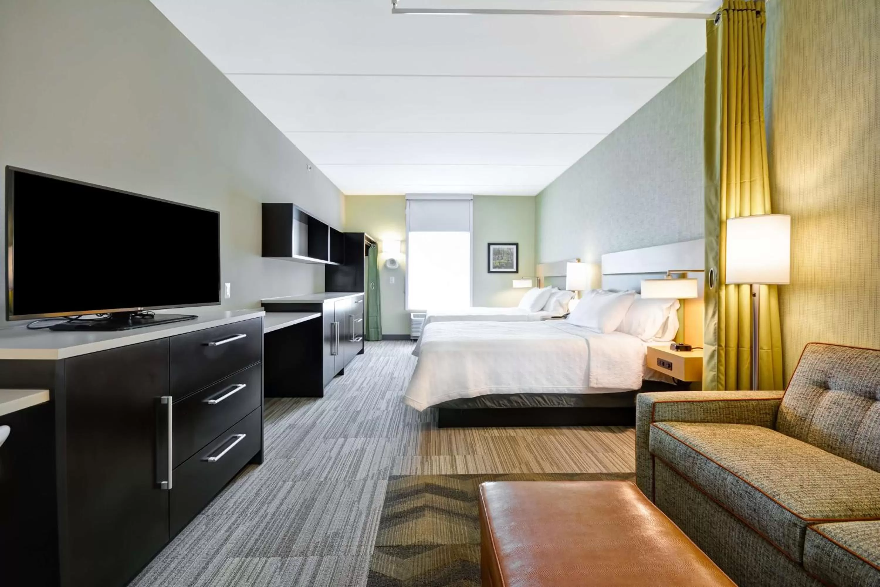 Living room, Bed in Home2 Suites By Hilton Charles Town