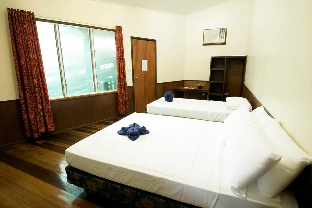 Bed in Tawali Leisure & Dive Resort