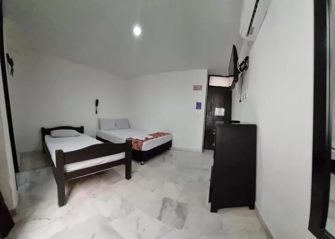 Bed in Blue Star Hotel