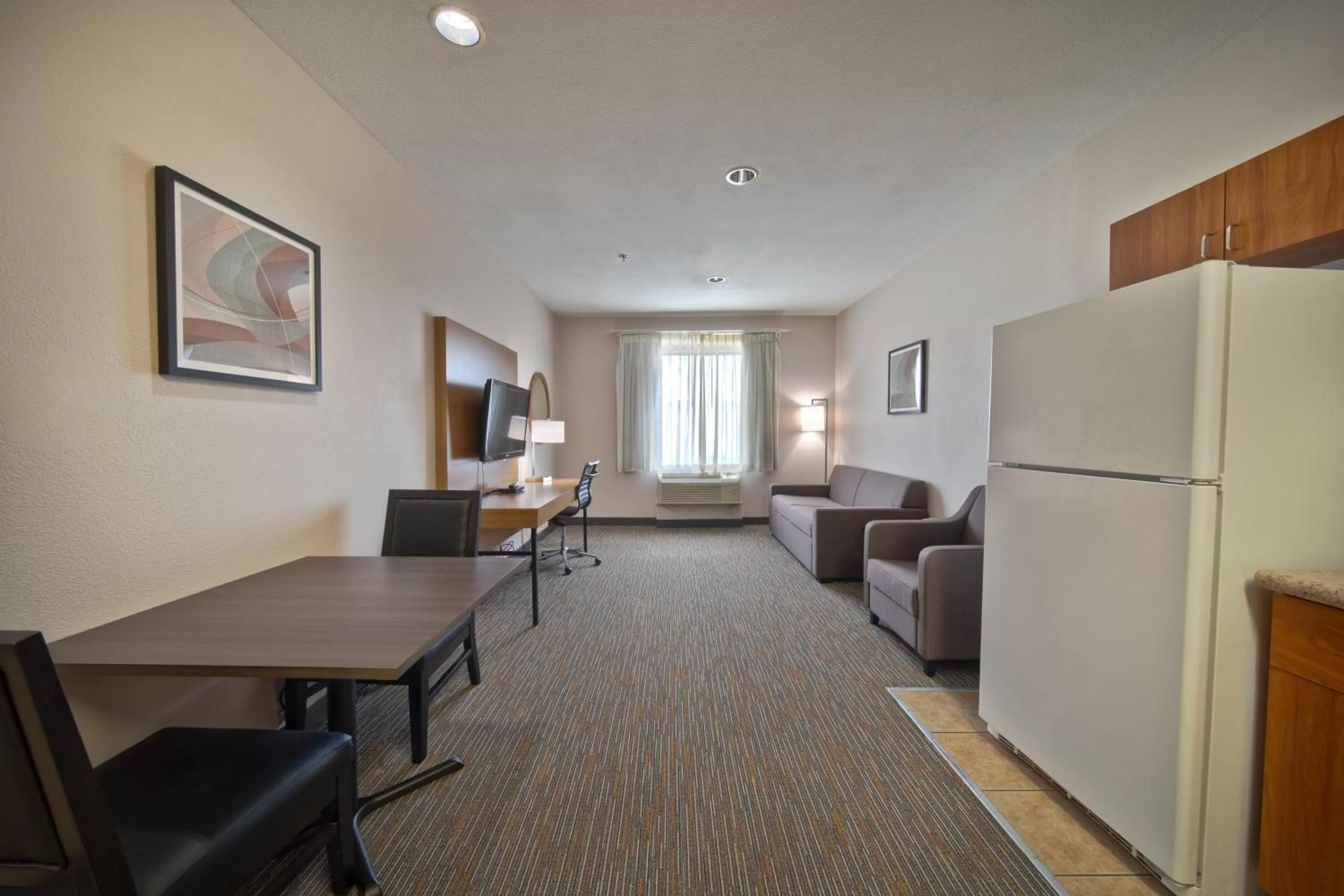 Living room in Wingate by Wyndham Houston Bush Intercontinental Airport