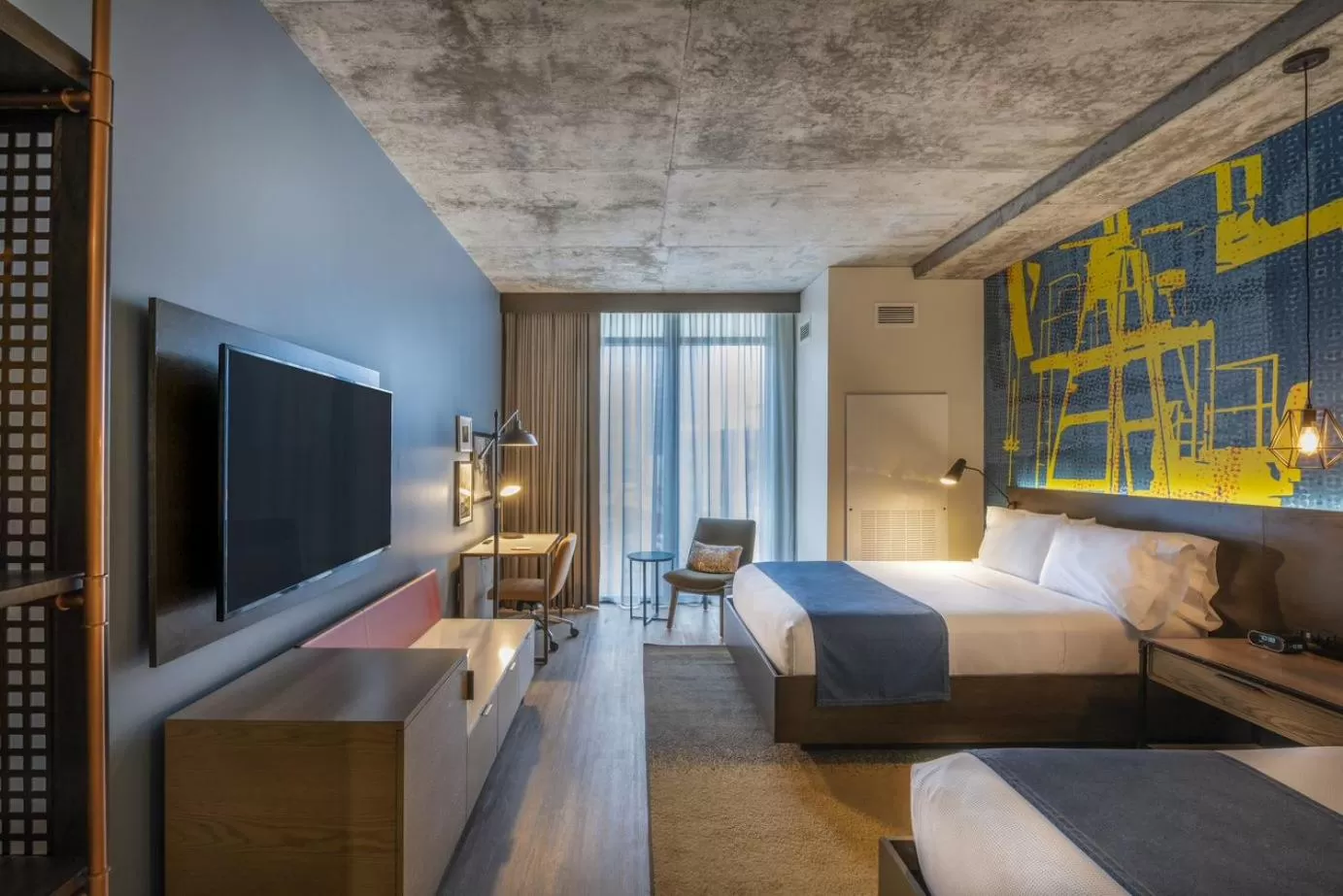 Bed in Hotel Indigo Tulsa DWTN/Entertainment Area