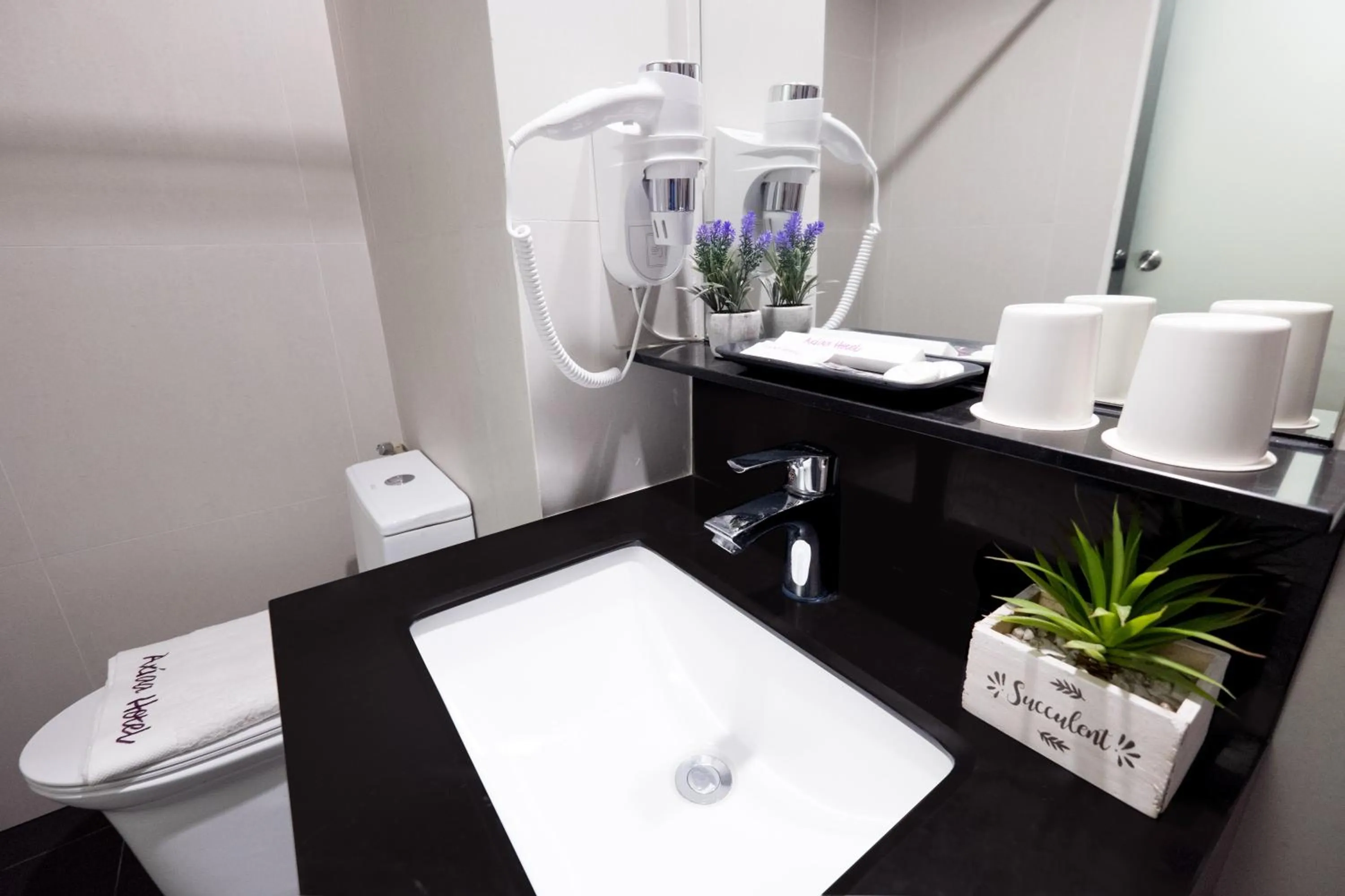 Bathroom in Axiaa Hotel