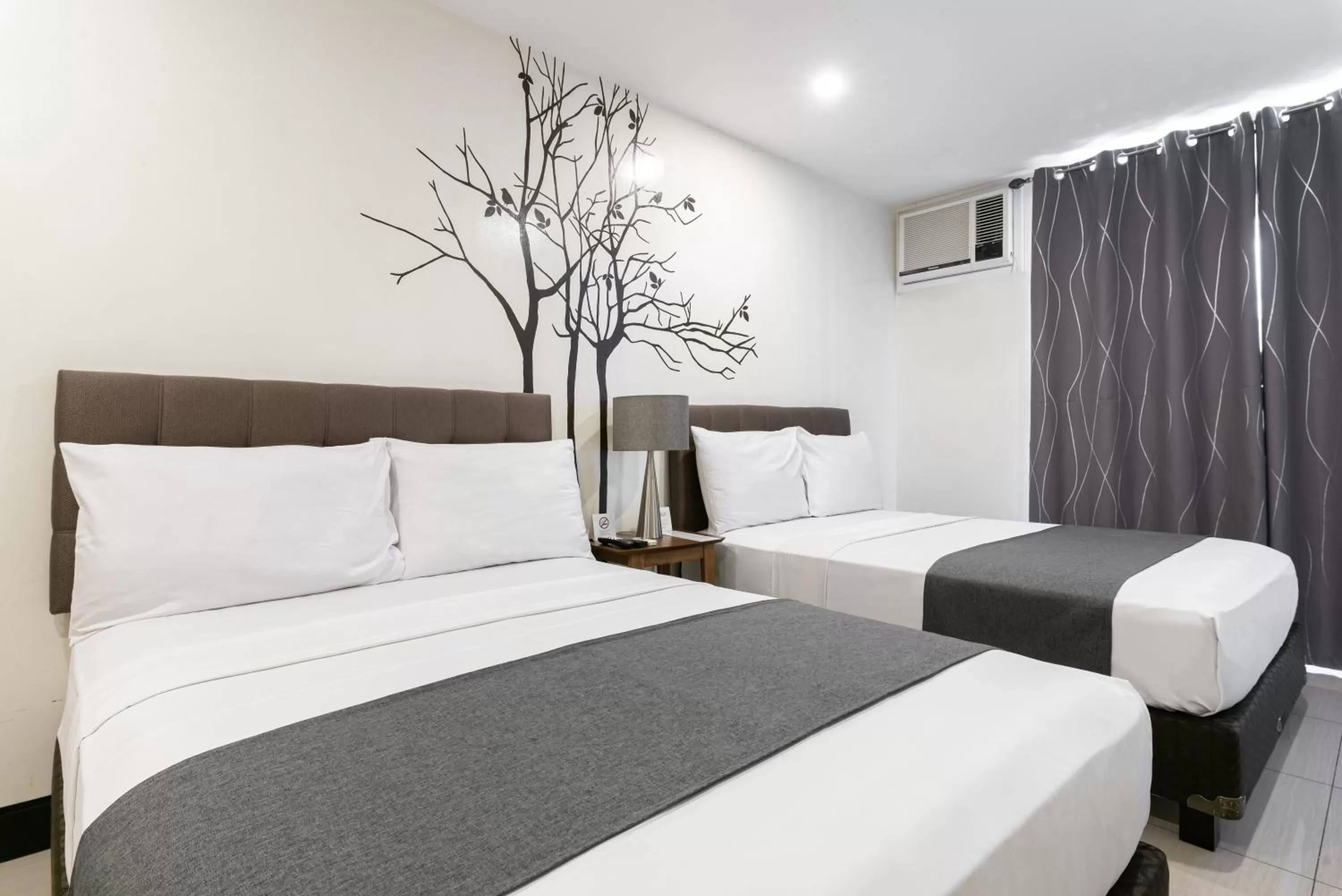 Bedroom, Bed in Artemis Place Makati Hotel