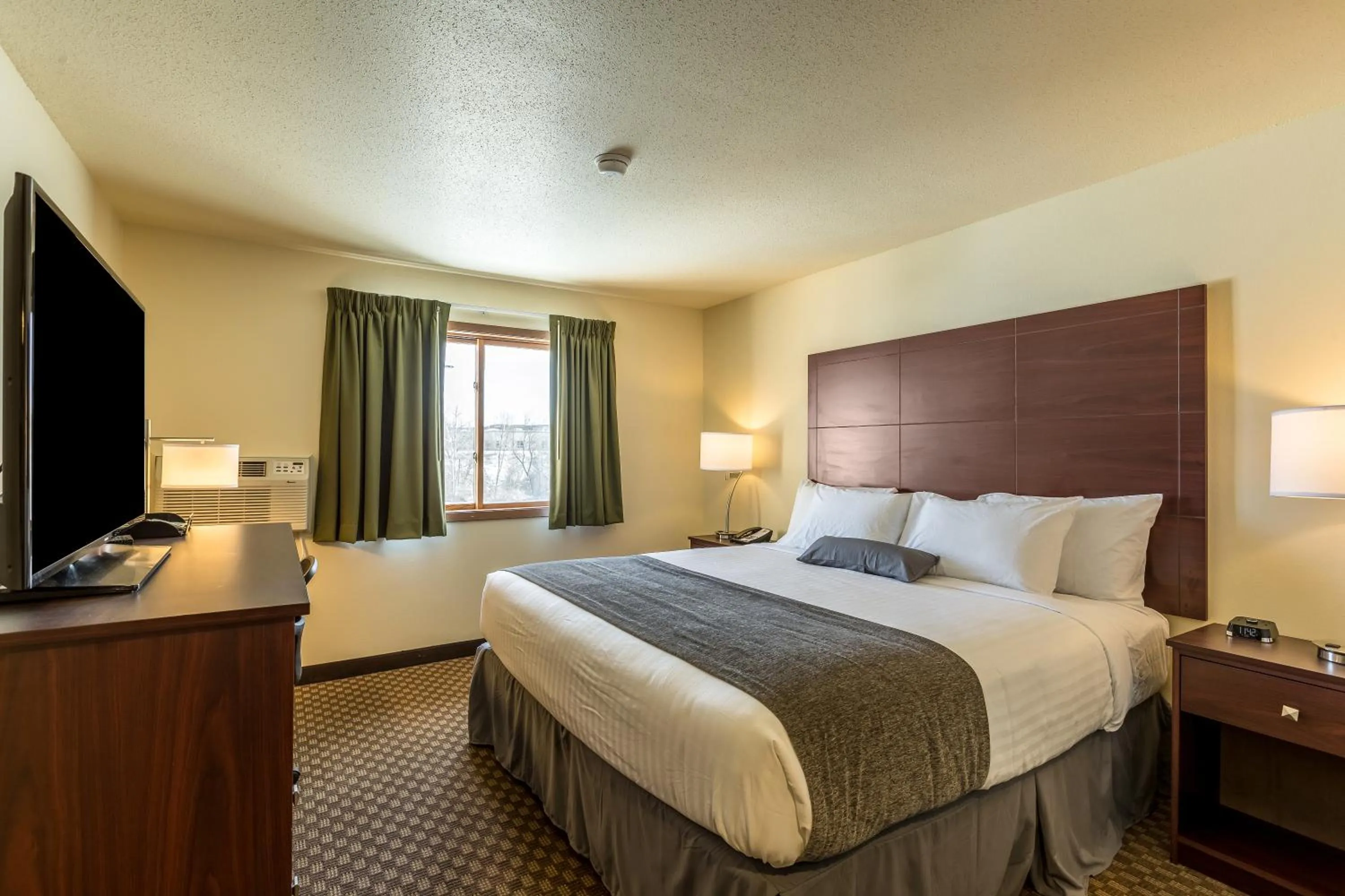 Bed in Cobblestone Inn & Suites - Merrill