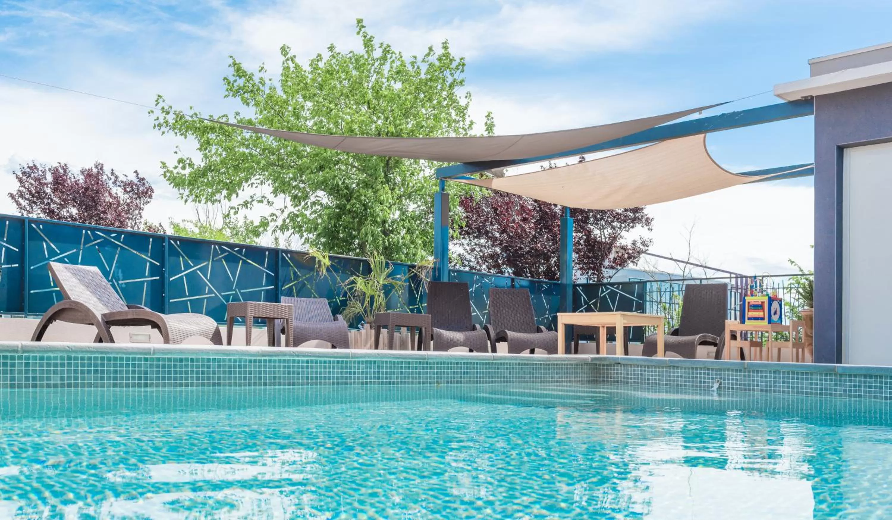 Swimming pool in Sure Hotel by Best Western Beziers Le Monestie