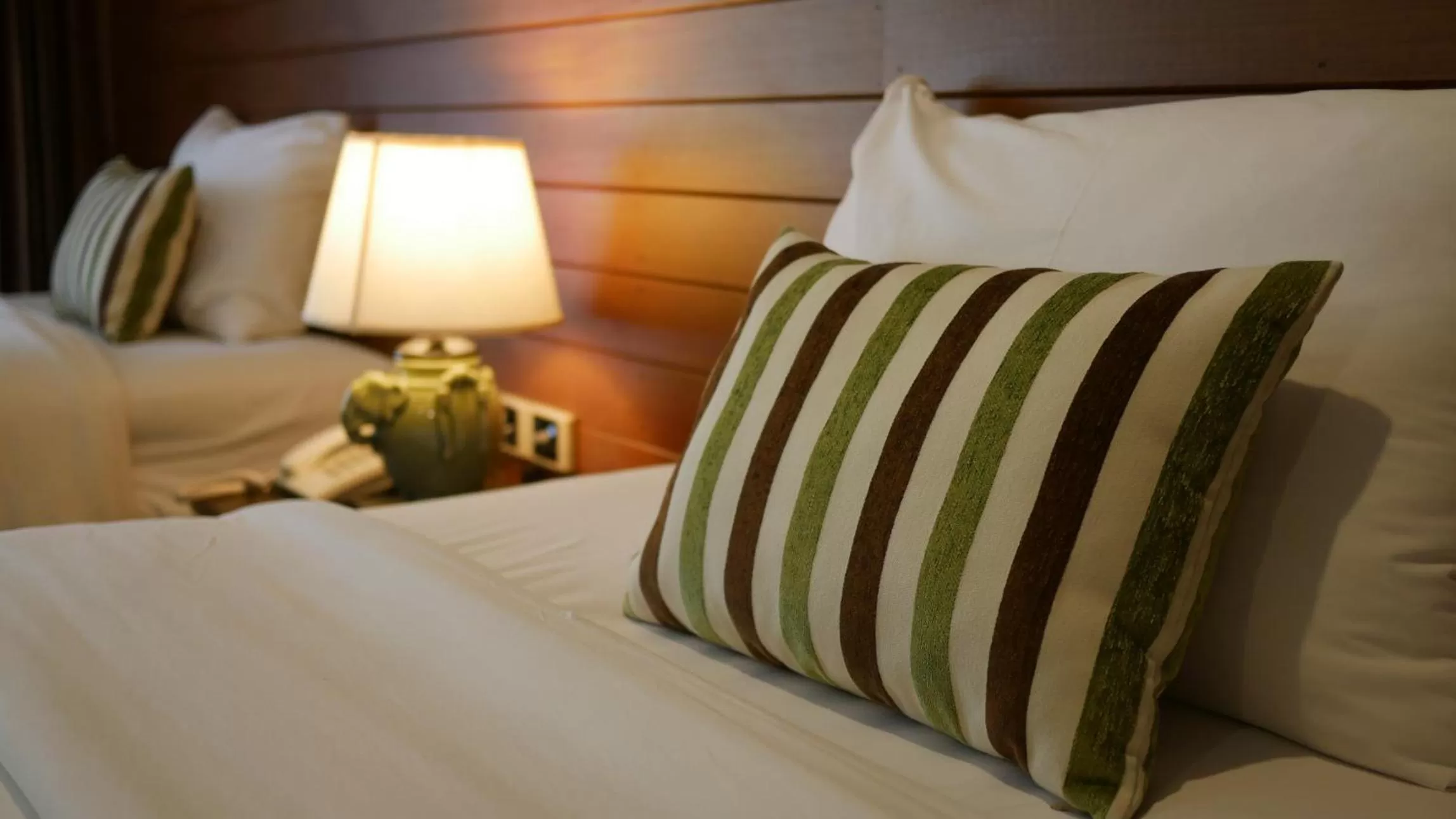 Bed in Royal River Kwai Resort and Spa