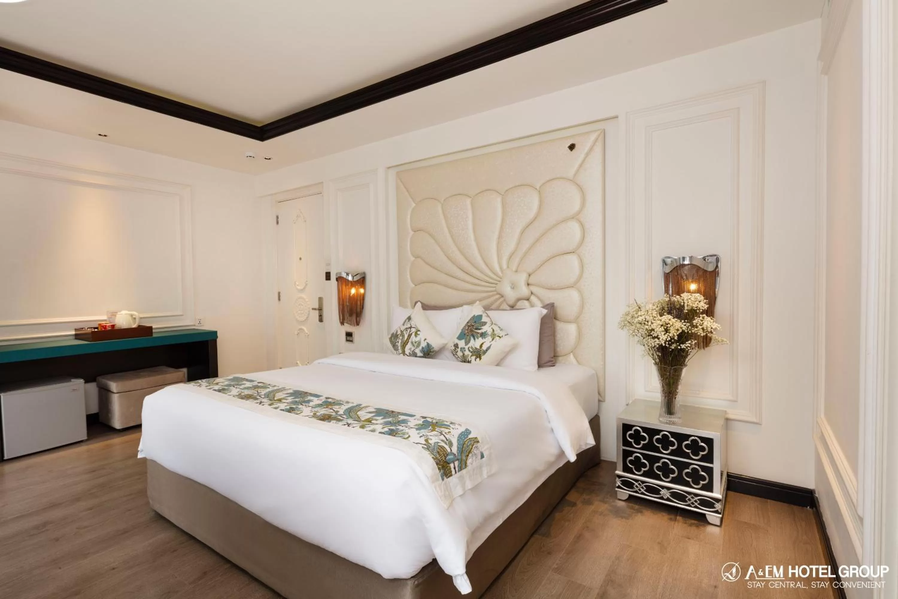 Bed in A&EM Saigon Hotel