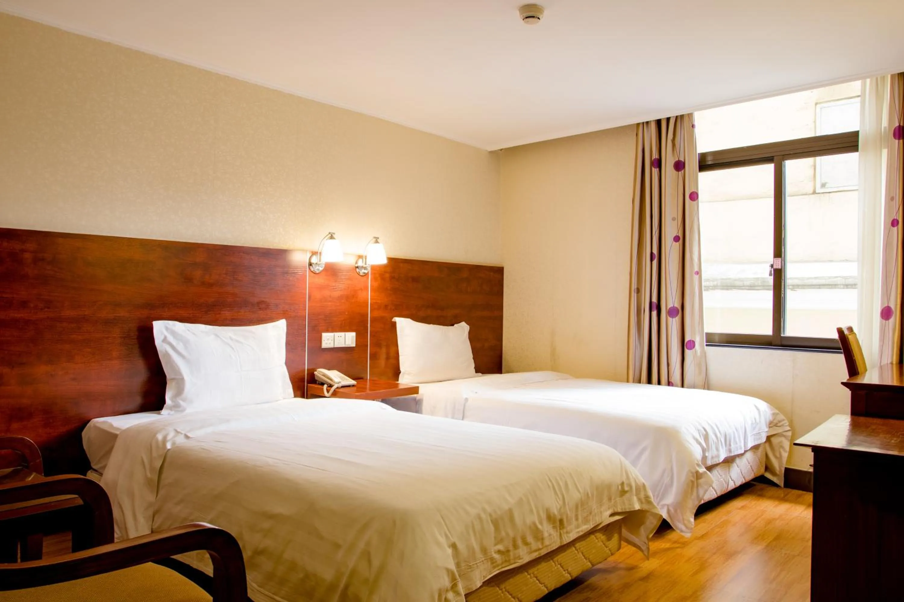 Bed in Guang Dong Hotel