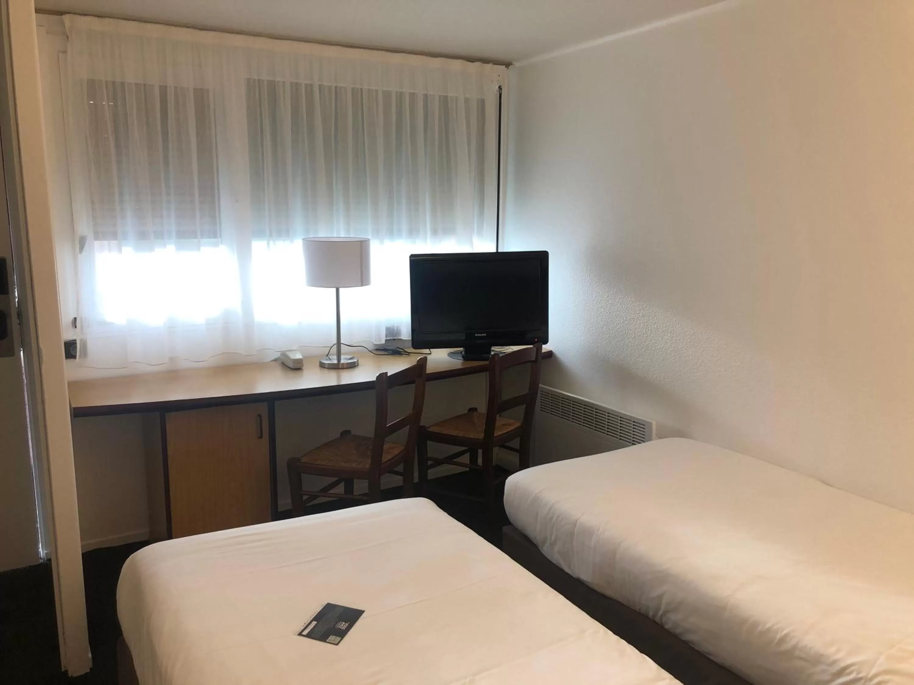 Photo of the whole room, Bed in Kyriad Niort - La Crèche