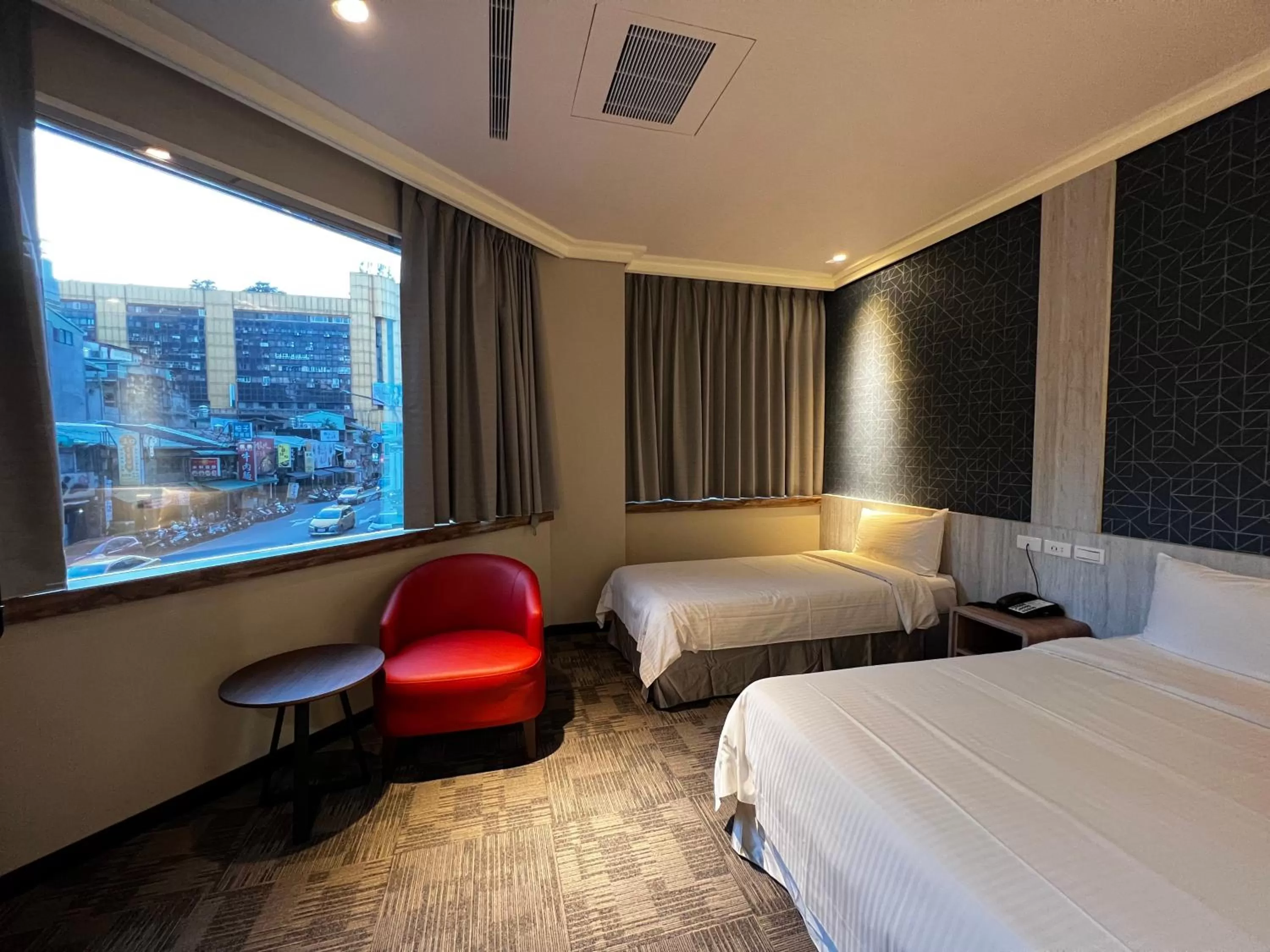 Bed in East Dragon Hotel