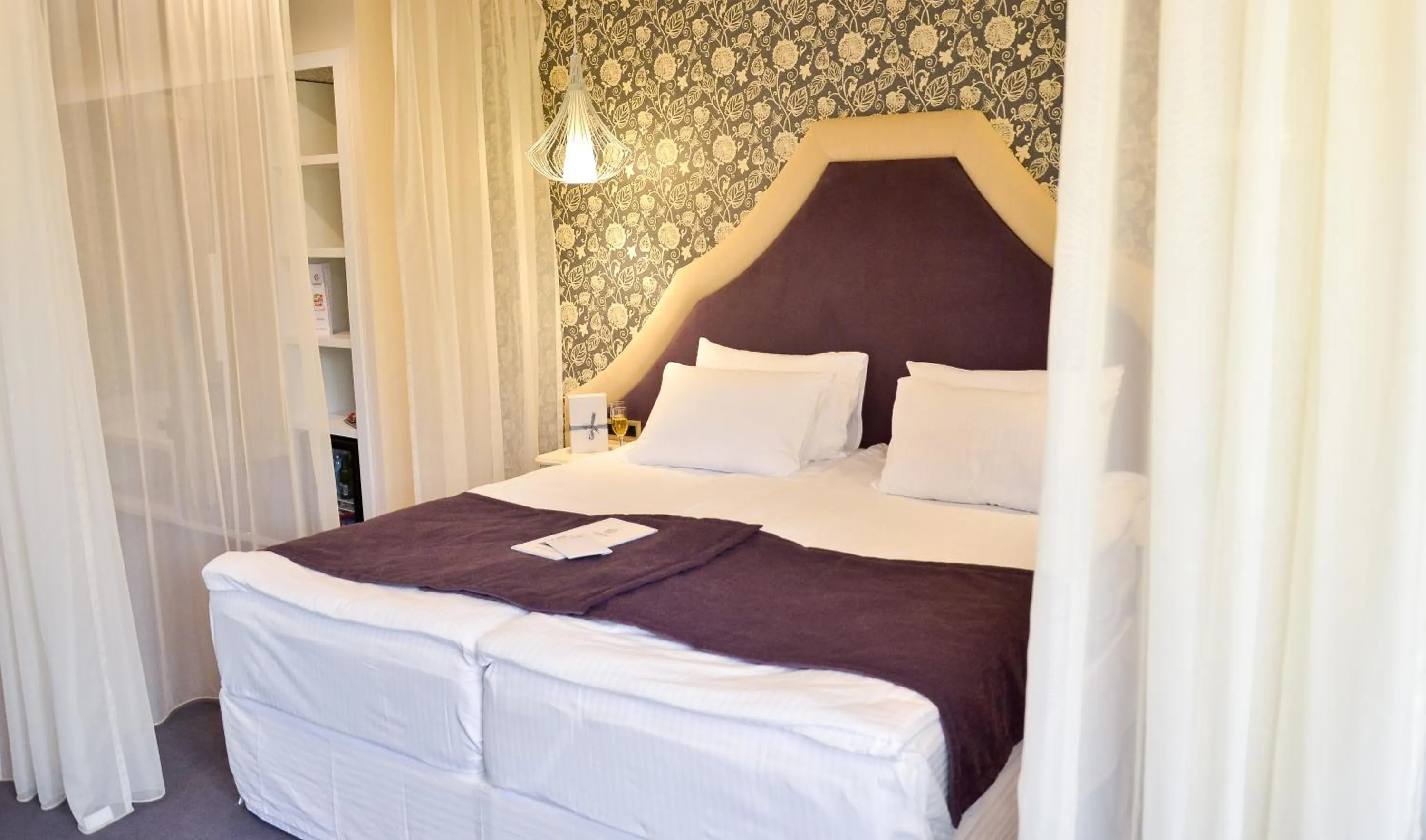 Bed in Hotel Capitolina City Chic