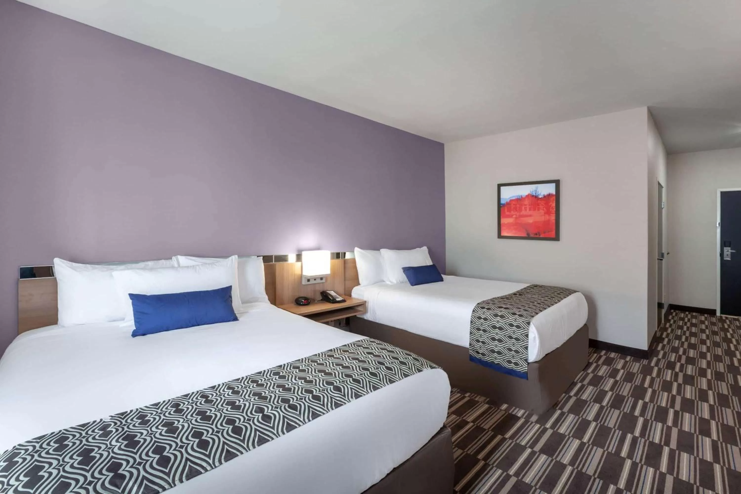 Queen Room with Two Queen Beds and Roll-In Shower - Mobility/Hearing Accessible - Non-Smoking in Microtel Inn & Suites by Wyndham College Station