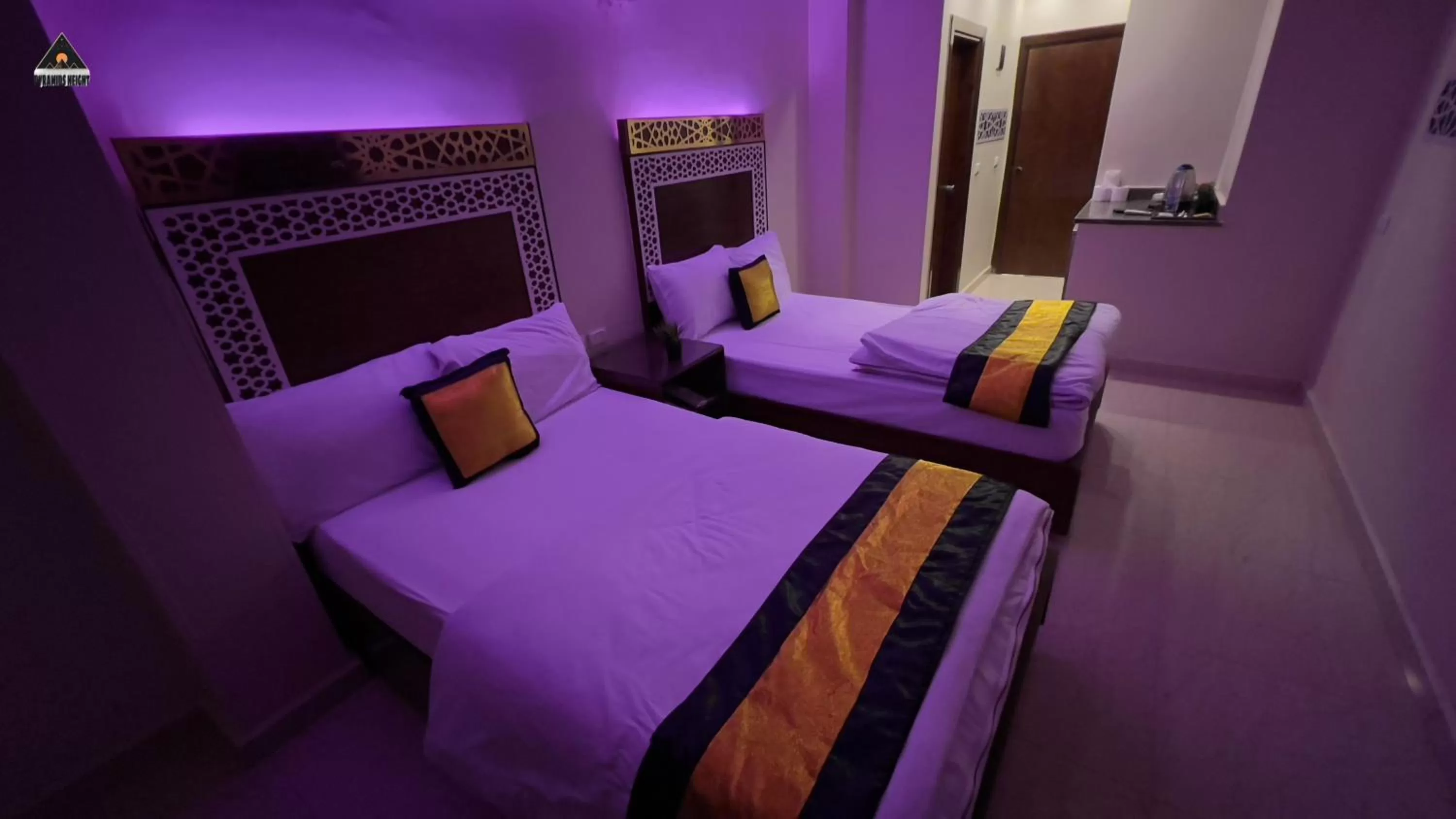 Bed in Pyramids Height Hotel & Pyramids Master Scene Rooftop