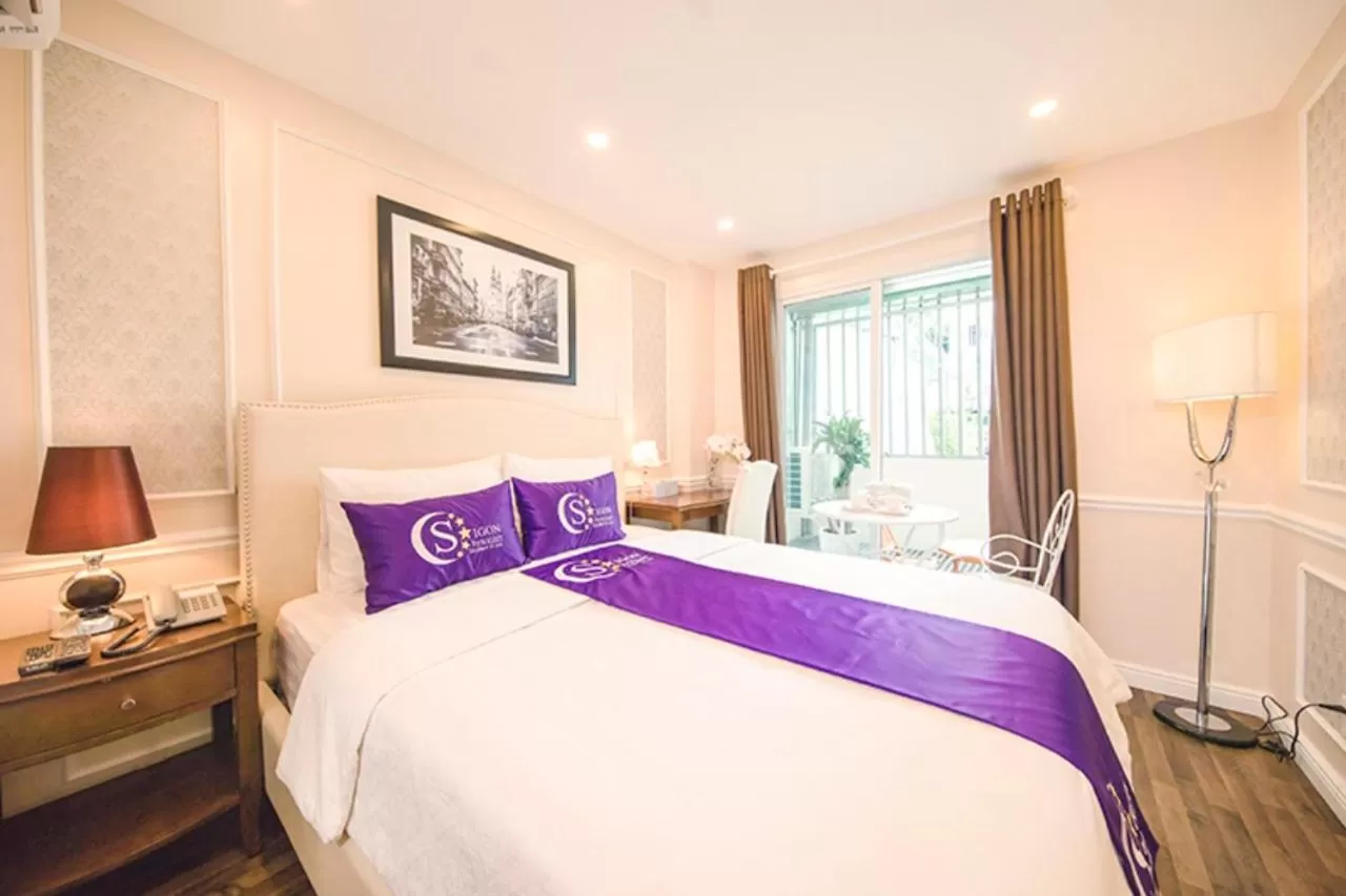 Bed in Saigon By Night Luxury Hotel