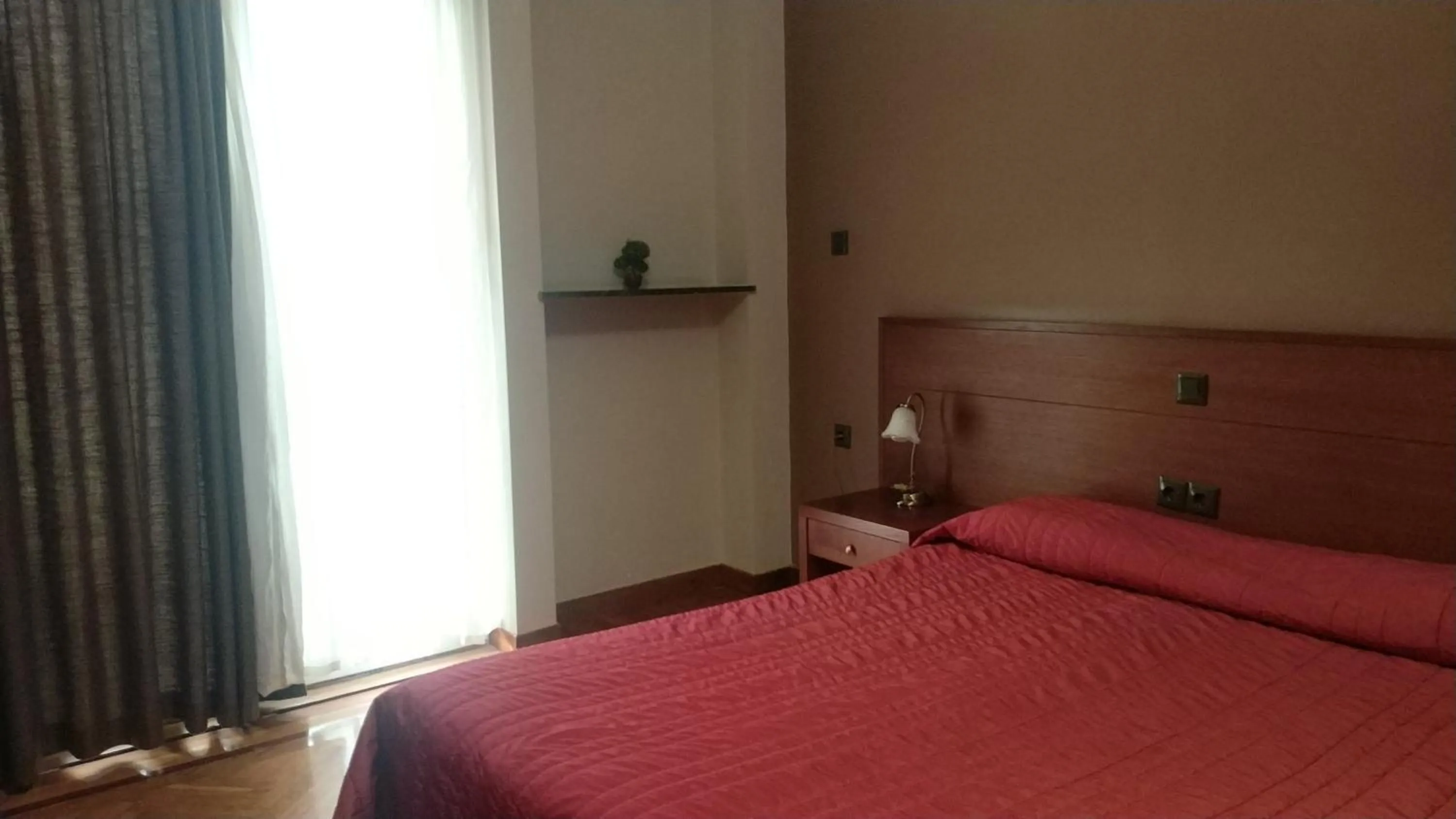 Bed in Ambrosia Suites