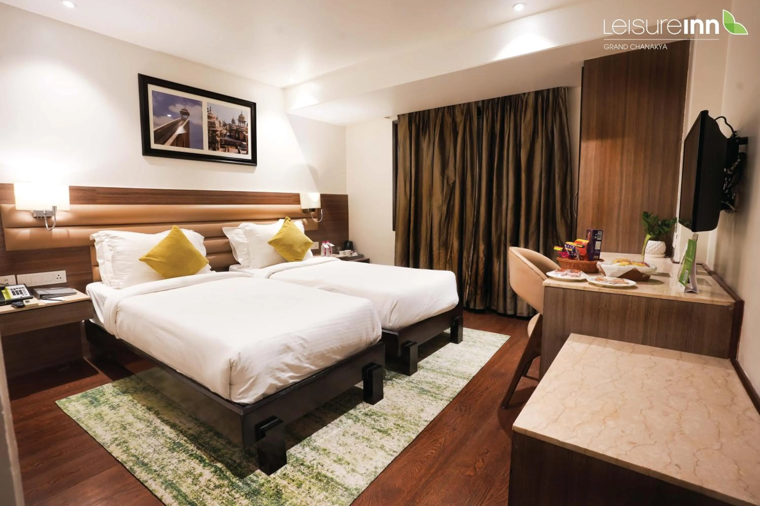 Photo of the whole room, Bed in Leisure Inn Grand Chanakya