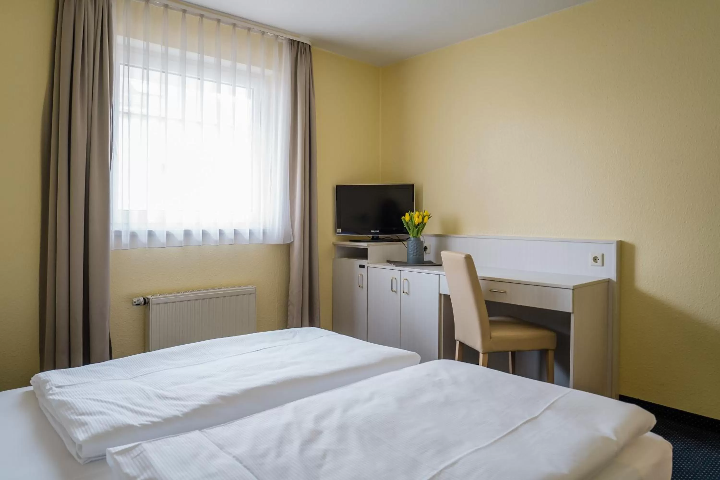 Bed in Point Hotel Apartments and Rooms