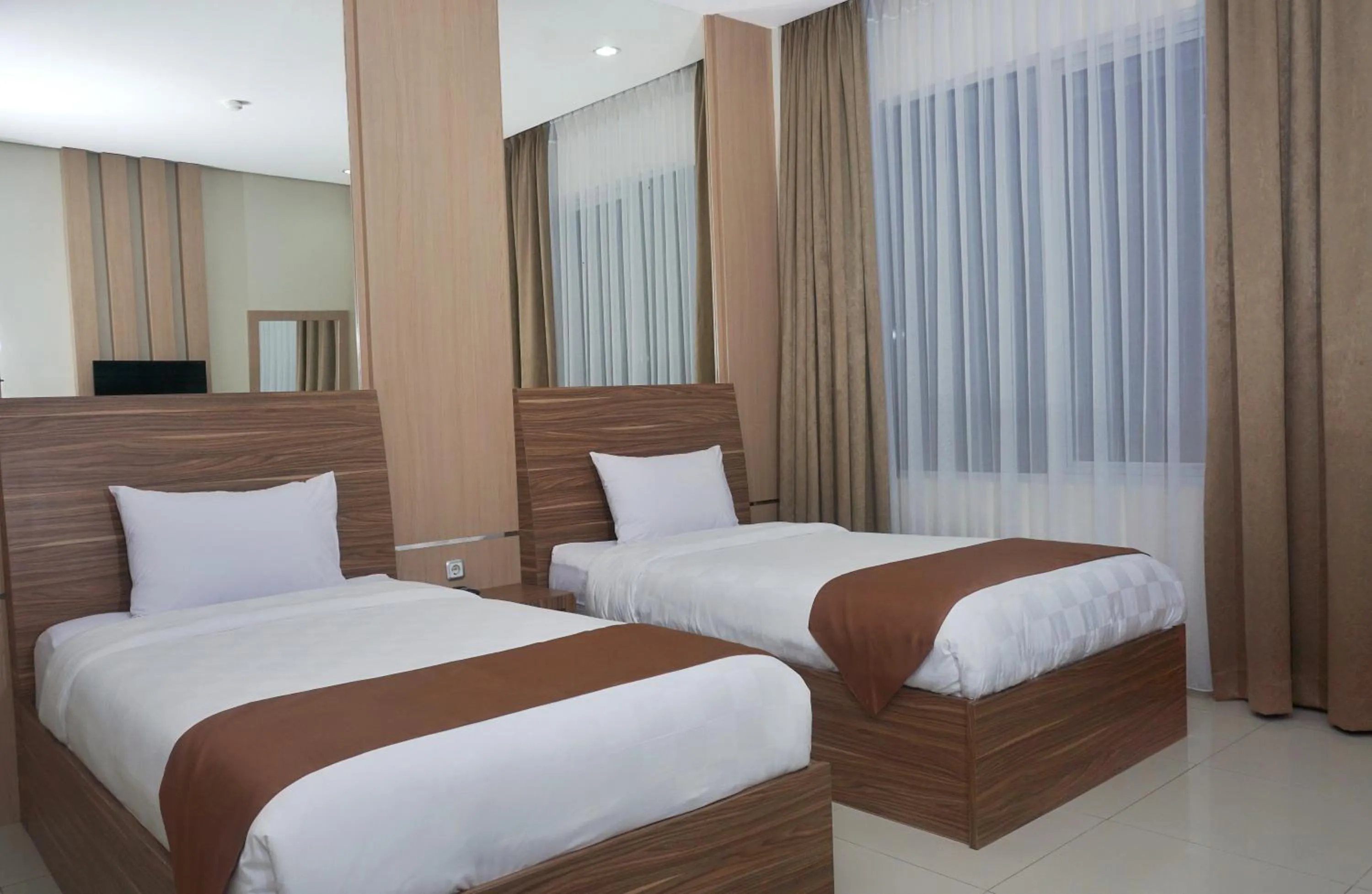 Photo of the whole room, Bed in Grand Cordela Hotel AS Putra Kuningan