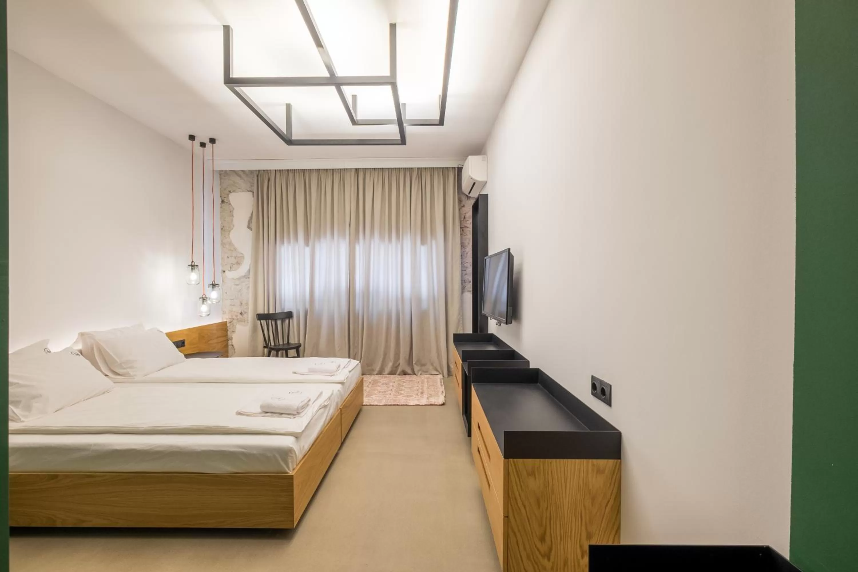 Bed in R34 Boutique Hotel