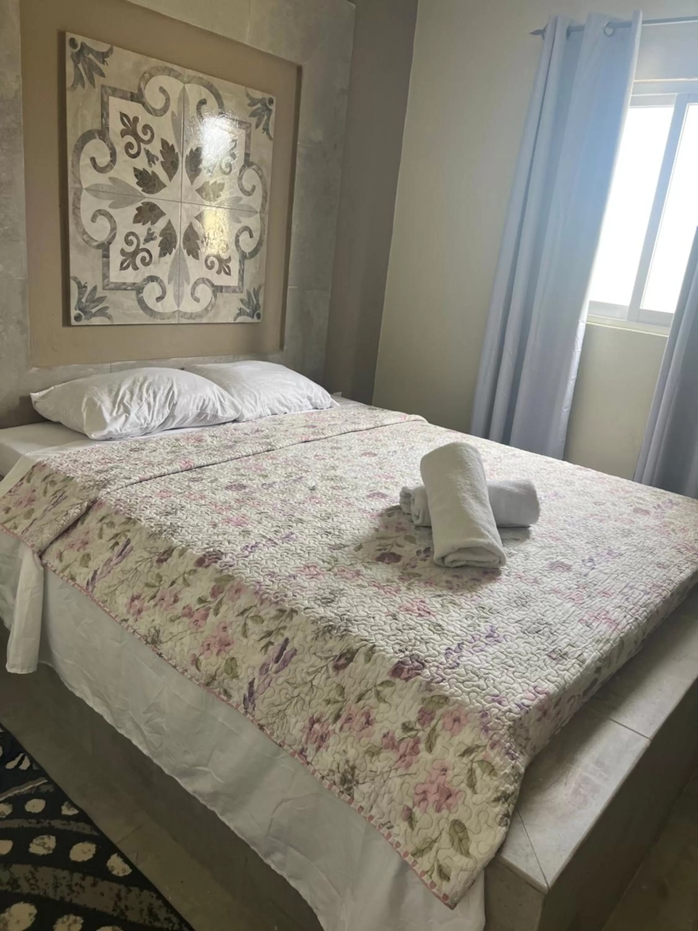 Bed in Curasita colour Appartments