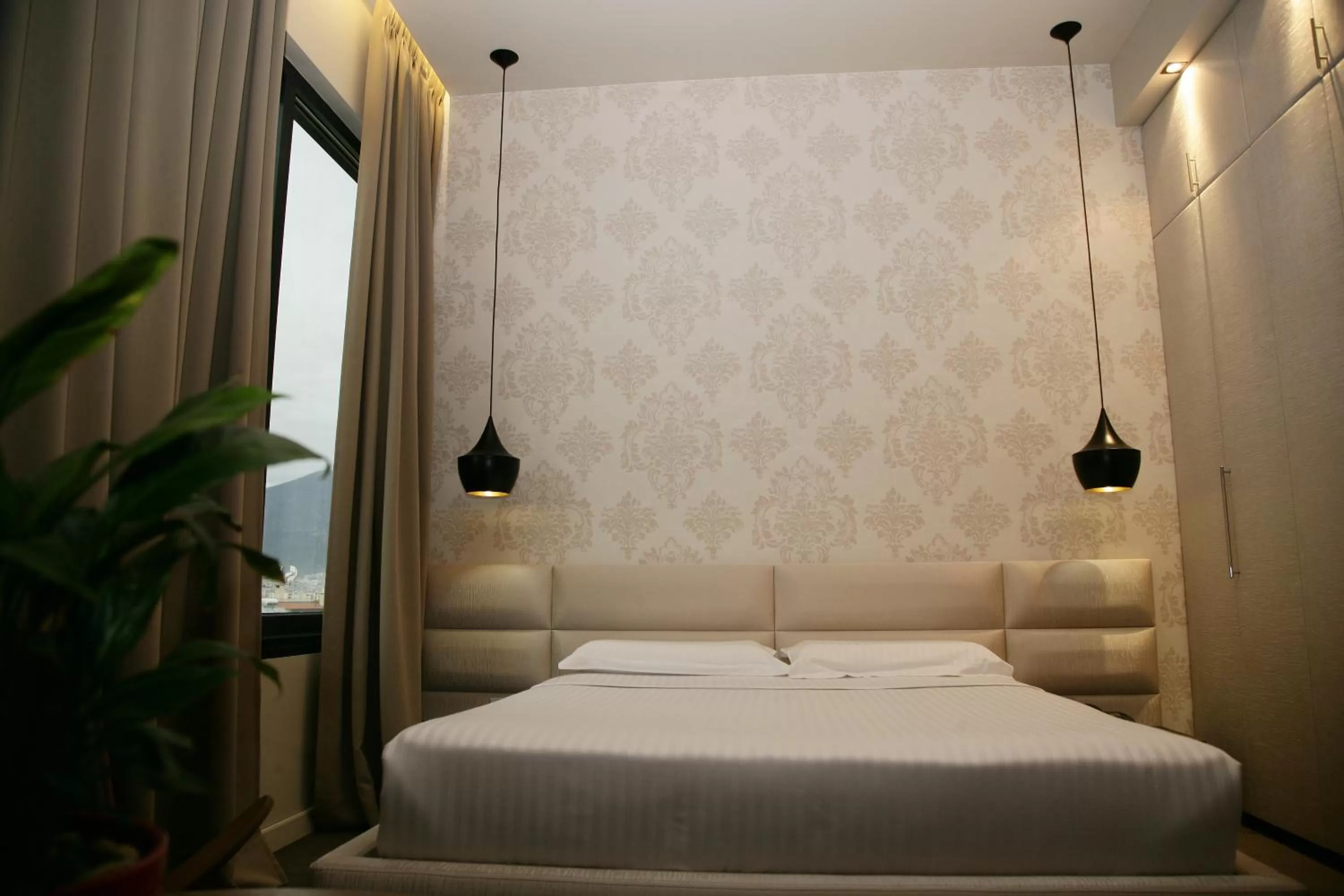 Bed in La Bohème Hotel