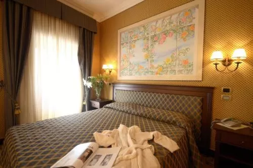 Bed in Hotel Don Carlo