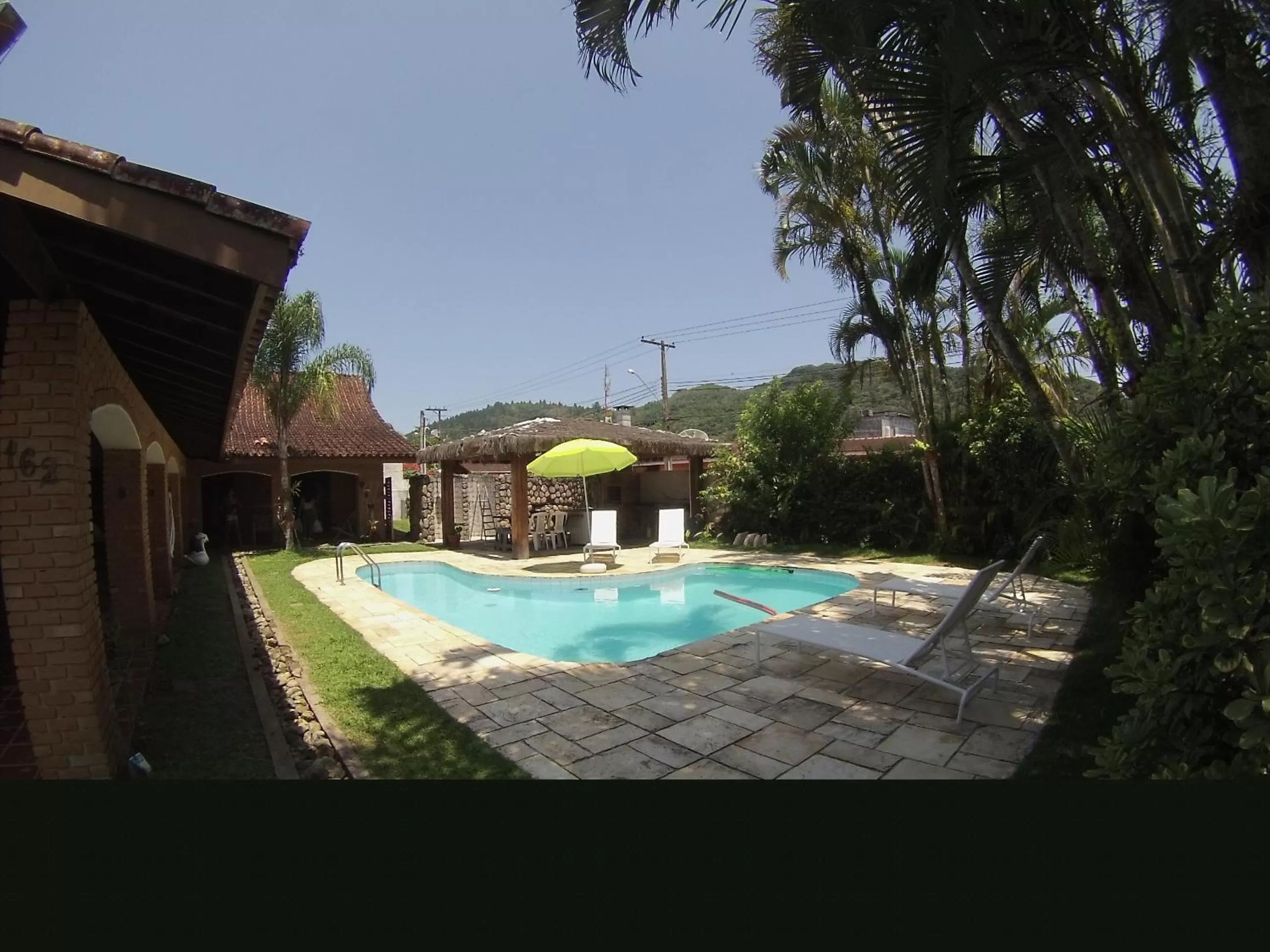 Swimming pool in Pousada Na Praia Ubatuba