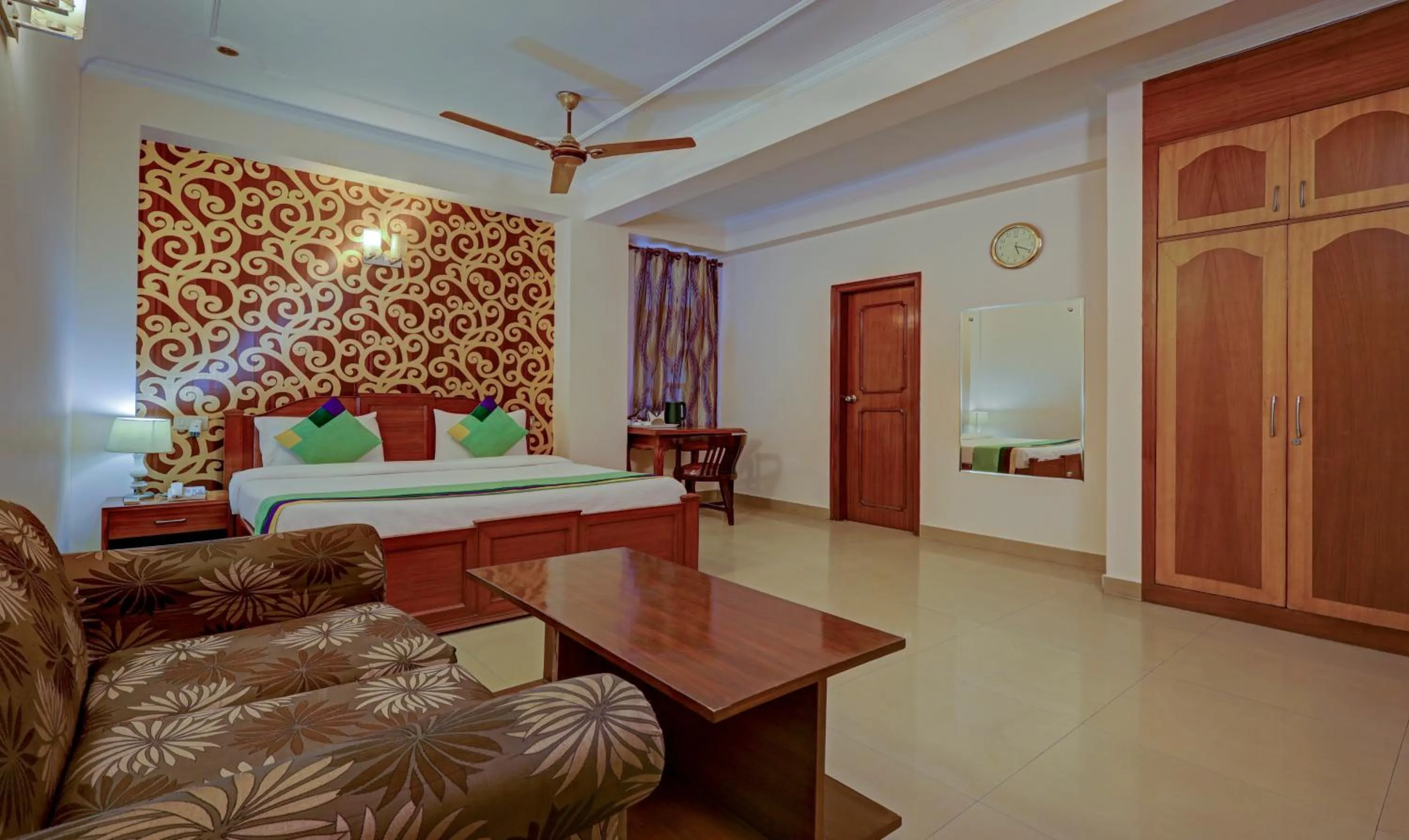 Seating area, Bed in Treebo Primeone