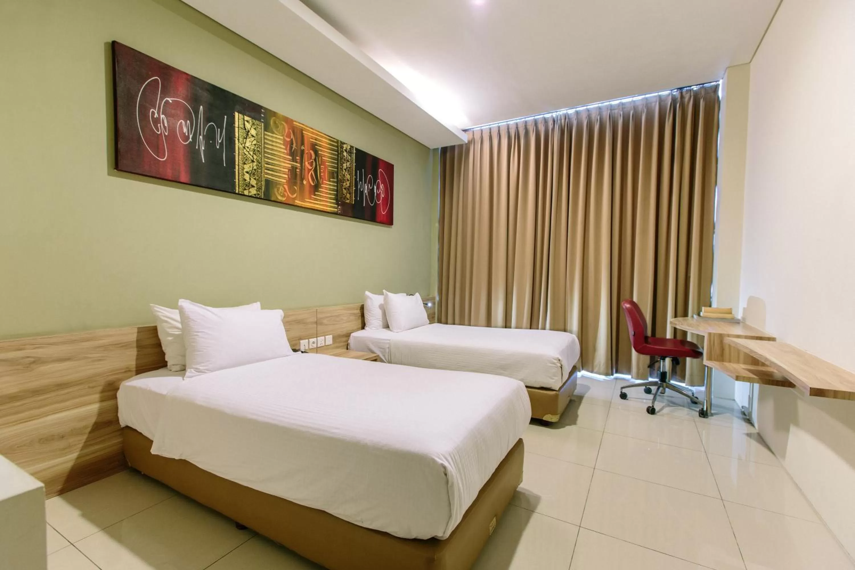 Bed in Mahogany Hotel