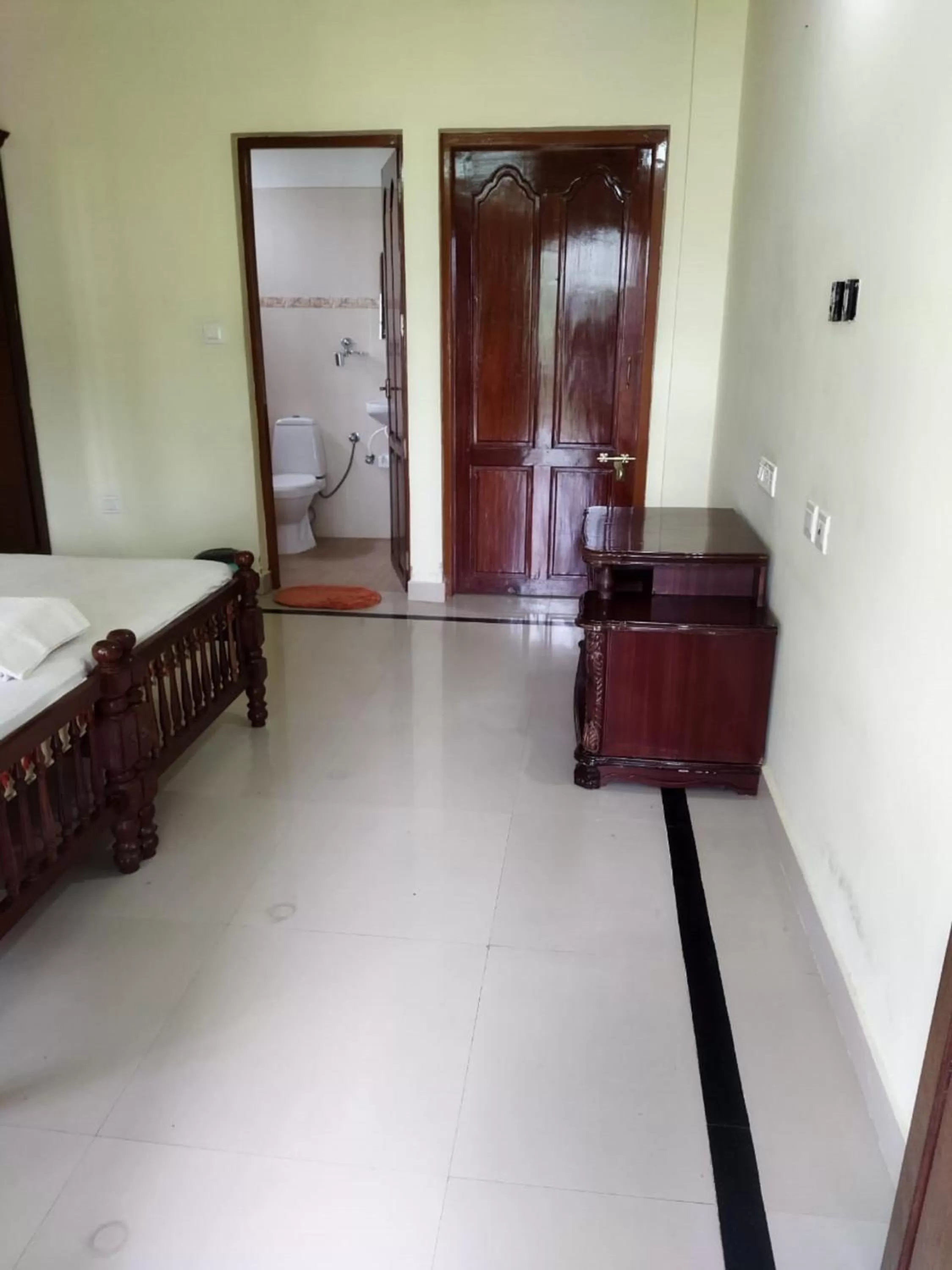 Bed in Sree Mookambika Beach Resort