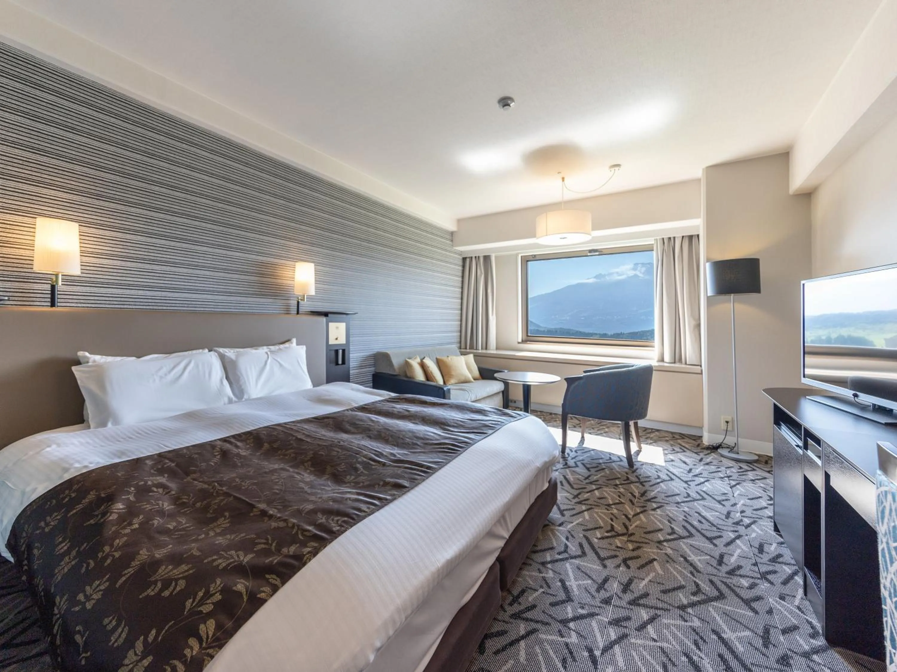 Photo of the whole room, Bed in APA Hotel & Resort Joetsu Myoko