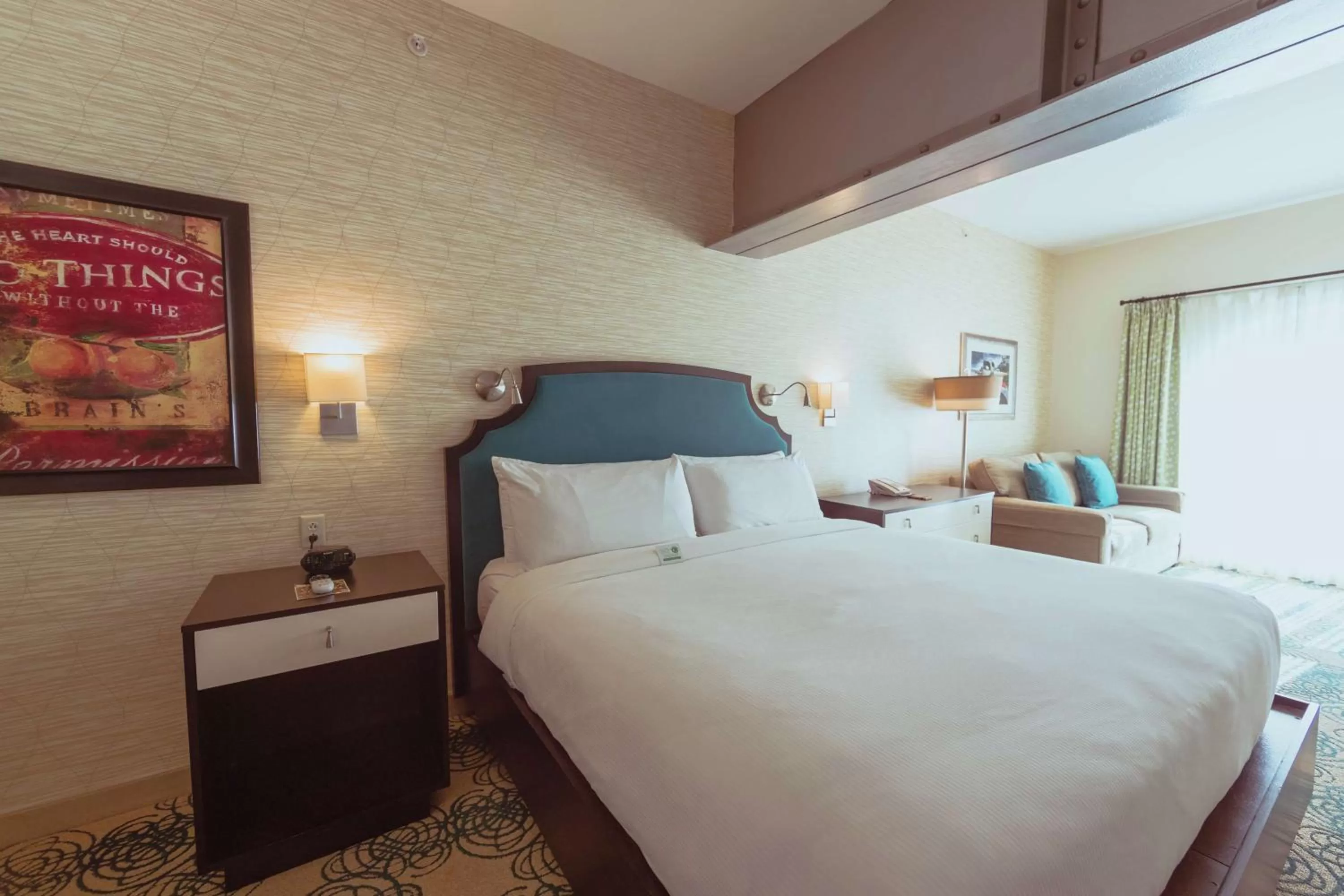 Living room, Bed in Hotel Skyler Syracuse, Tapestry Collection by Hilton