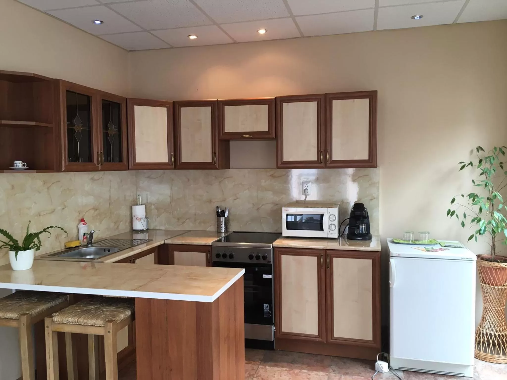 Kitchen or kitchenette in Abszolút Hotel és Panzió