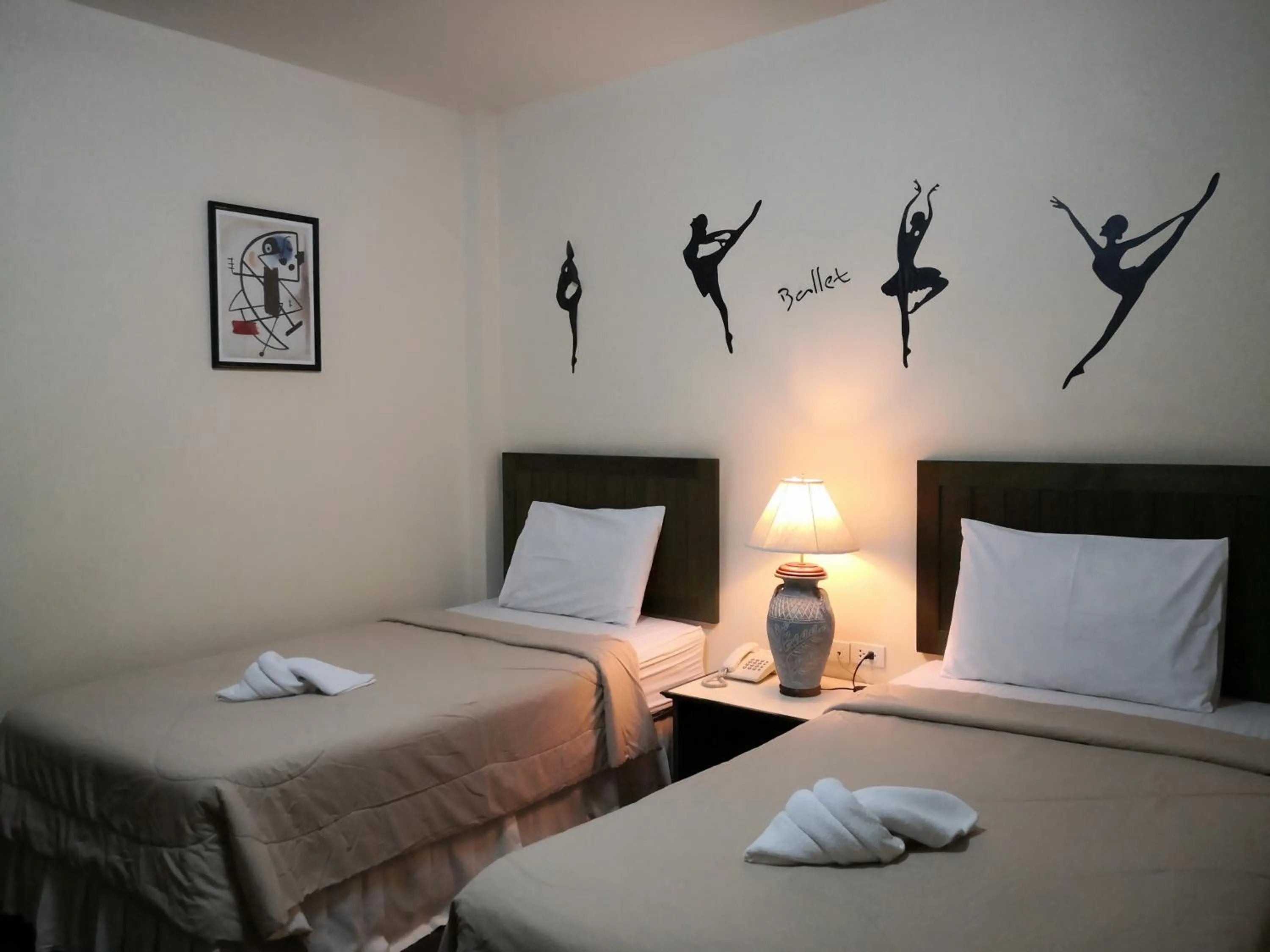 Bed in Baan Suksiri Hotel